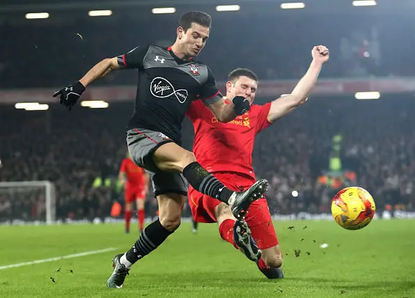 Cedric Soares of Southampton and James Milner of Liverpool clash during the EFL Cup Semi-Final Second Leg match between Liverpool and Southampton at Anfield on January 25, 2017 in Liverpool, England.  (Photo by Julian Finney/Getty Images)