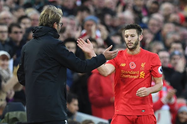 Liverpool's English midfielder Adam Lallana is congratulated by Liverpool's German manager Jurgen Klopp as he is substituted off of the pitch during the English Premier League football match between Liverpool and Watford at Anfield in Liverpool, north west England on November 6, 2016. / AFP / PAUL ELLIS / RESTRICTED TO EDITORIAL USE. No use with unauthorized audio, video, data, fixture lists, club/league logos or 'live' services. Online in-match use limited to 75 images, no video emulation. No use in betting, games or single club/league/player publications.  /         (Photo credit should read PAUL ELLIS/AFP/Getty Images)