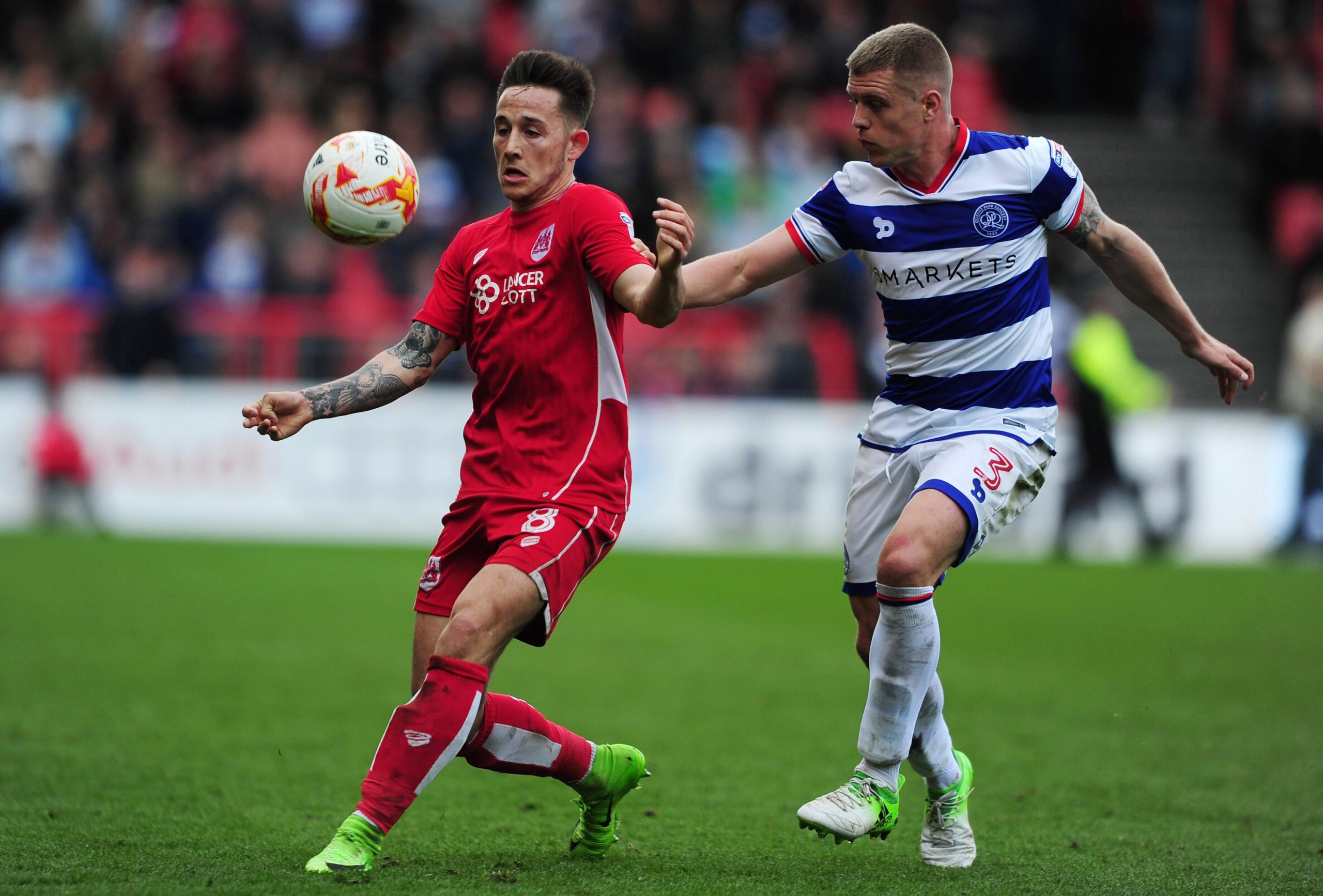 BRISTOL, UNITED KINGDOM - APRIL 14: Josh Brownhill of Bristol City is tackled by Jake Bidwell of Queens Park Rangers during the Sky Bet Championship match between Bristol City and Queens Park Rangers at Ashton Gate on April 14, 2017 in Bristol, England. (Photo by Harry Trump/Getty Images)
