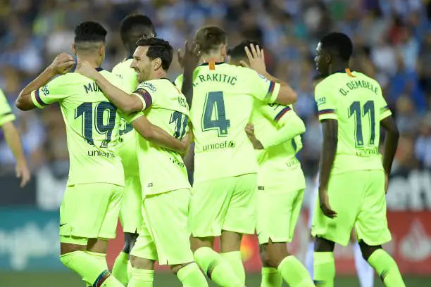 Barcelona players celebrate their opening goal during the Spanish league football match Club Deportivo Leganes SAD against FC Barcelona at the Estadio Municipal Butarque in Leganes on the outskirts of Madrid on September 26, 2018. (Photo by OSCAR DEL POZO / AFP)        (Photo credit should read OSCAR DEL POZO/AFP/Getty Images)