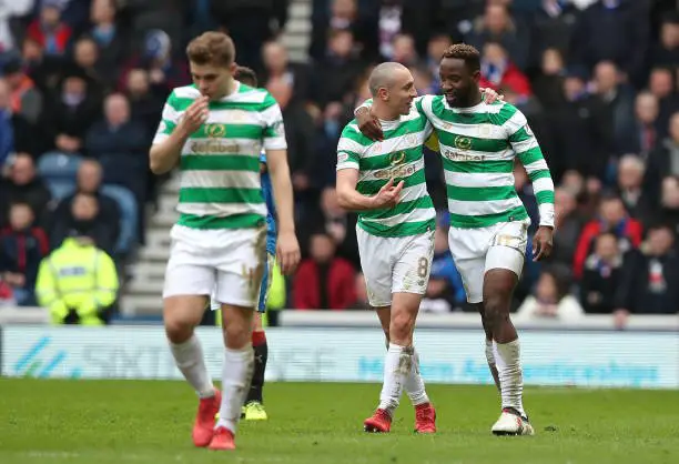 GLASGOW, SCOTLAND - MARCH 11: Moussa Dembele of Celtic celebrates after scoring his sides second goal with Scott Brown of Celtic during the Ladbrokes Scottish Premiership match between Rangers and Celtic at Ibrox Stadium on March 11, 2018 in Glasgow, Scotland.  (Photo by Ian MacNicol/Getty Images)