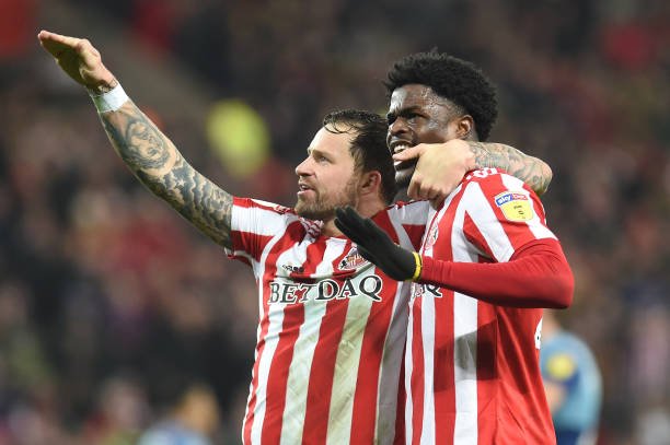SUNDERLAND, ENGLAND - NOVEMBER 17: Josh Maja of Sunderland celebrates with teammate Chris Maguire after scoring his team's first goal during the Sky Bet League One match between Sunderland and Wycombe Wanderers at Stadium of Light on November 17, 2018 in Sunderland, United Kingdom. (Photo by Harriet Lander/Getty Images)