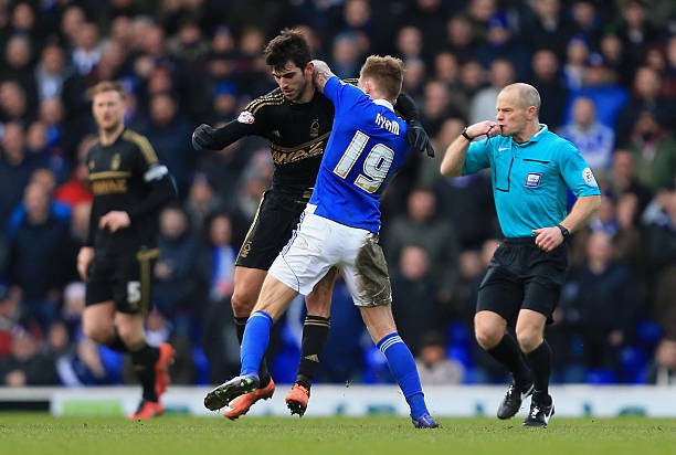IPSWICH, ENGLAND - MARCH 5:  Luke Hyam of Ipswich Town and Nelson Oliviera of Nottingham Forest clash during the Sky Bet Championship match between Ipswich Town and Nottingham Forest at Portman Road on March 5, 2016 in Ipswich, England. (Photo by Stephen Pond/Getty Images)