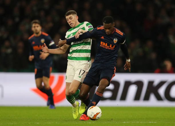 GLASGOW, SCOTLAND - FEBRUARY 14:  Ryan Christie of Celtic battles for possession with Geoffrey Kondogbia of Valencia during the UEFA Europa League Round of 32 First Leg match between Celtic and Valencia at Celtic Park on February 14, 2019 in Glasgow, Scotland, United Kingdom.  (Photo by Ian MacNicol/Getty Images)