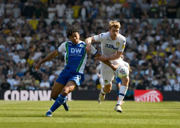 LEEDS, ENGLAND - APRIL 19: Patrick Bamford of Leeds United and Reece James of Wigan Athletic compete for the ball during the Sky Bet Championship between Leeds United and Wigan Athletic at Elland Road on April 19, 2019 in Leeds, England. (Photo by George Wood/Getty Images)
