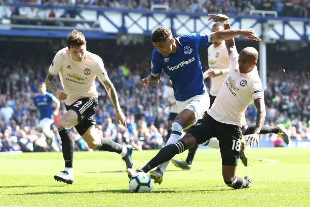 LIVERPOOL, ENGLAND - APRIL 21: Dominic Calvert-Lewin of Everton is challenged by Ashley Young of Manchester United during the Premier League match between Everton FC and Manchester United at Goodison Park on April 21, 2019 in Liverpool, United Kingdom. (Photo by Jan Kruger/Getty Images)