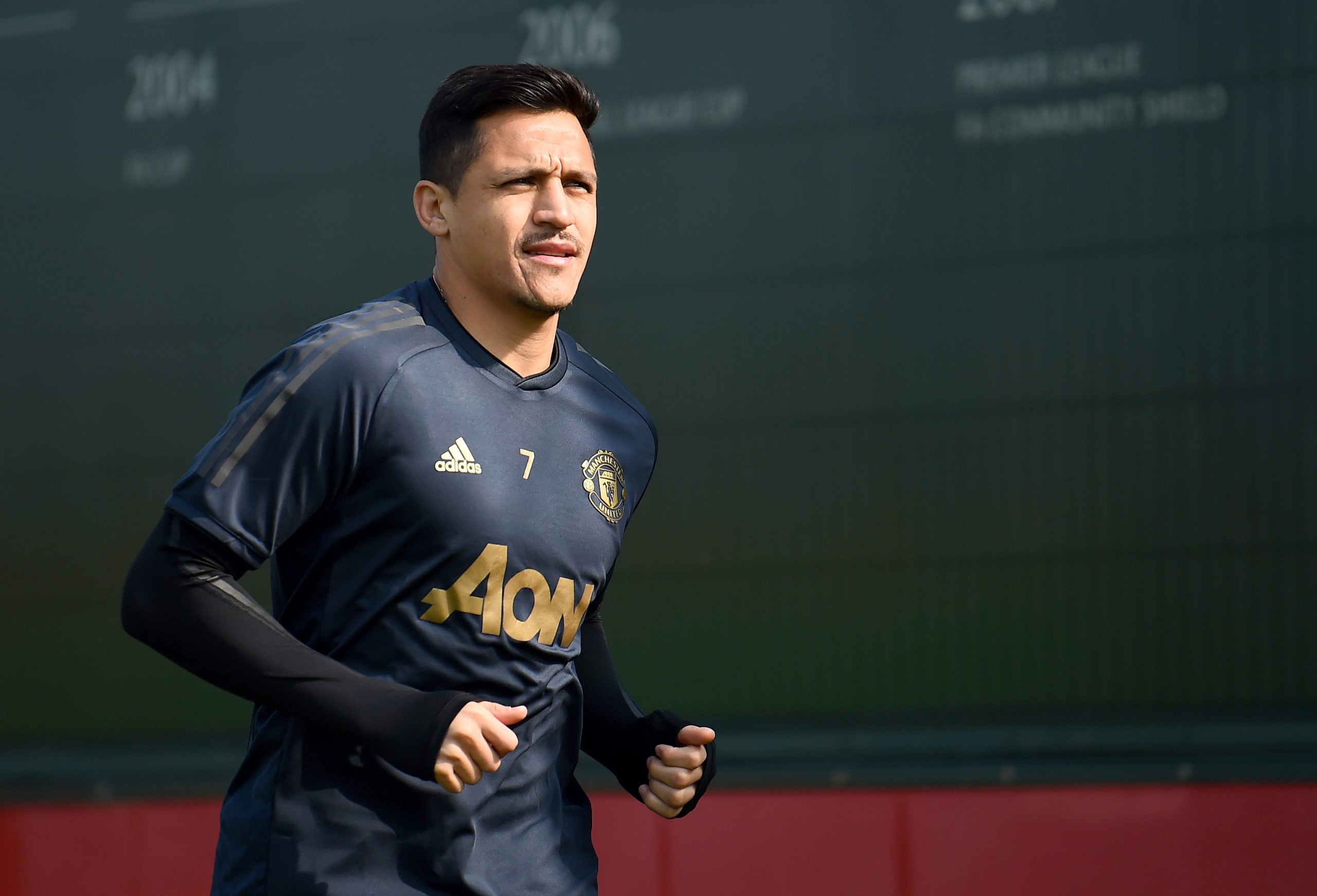 Alexis Sanchez of Manchester United walks off after the Manchester United training session ahead of the UEFA Champions League Quarter Final First Leg match between Manchester United v FC Barcelona at Aon Training Complex on April 09, 2019 in Manchester, England. (Photo by Nathan Stirk/Getty Images)