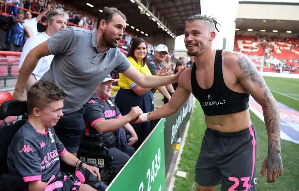 BRISTOL, ENGLAND - AUGUST 04: Kalvin Phillips of Leeds United gives his shirt to a fan after the game during the Sky Bet Championship match between Bristol City and Leeds United at Ashton Gate on August 04, 2019 in Bristol, England. (Photo by Alex Davidson/Getty Images)