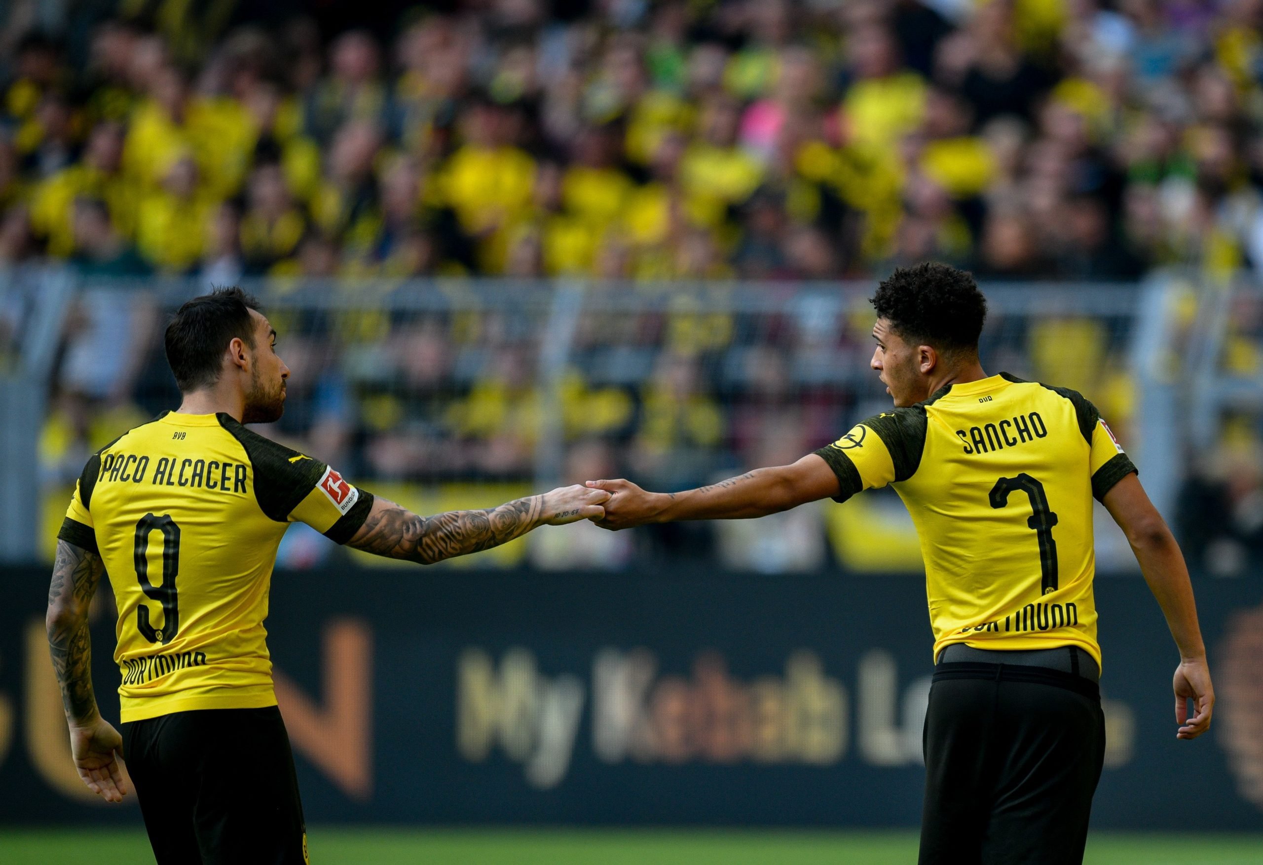 Dortmund's Spanish forward Paco Alcacer (L) and Dortmund's English midfielder Jadon Sancho react during the German first division Bundesliga football match Borussia Dortmund v VfL Wolfsburg on March 30, 2019 in Dortmund. (Photo by SASCHA SCHUERMANN / AFP) / RESTRICTIONS: DFL REGULATIONS PROHIBIT ANY USE OF PHOTOGRAPHS AS IMAGE SEQUENCES AND/OR QUASI-VIDEO        (Photo credit should read SASCHA SCHUERMANN/AFP/Getty Images)