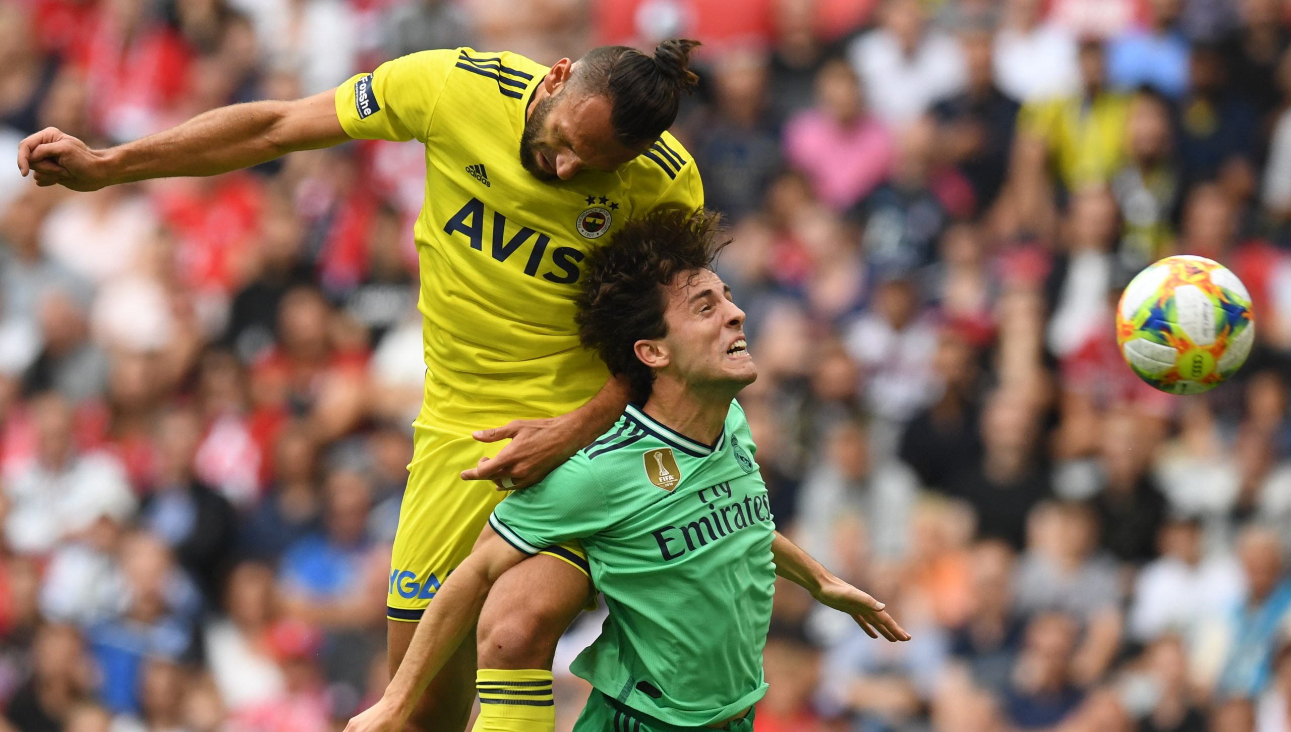 Fenerbahce's Kosovan striker Vedat Muriqi and Real Madrid's Brazilian forward Vinicius Junior (R) vie for the ball  during the Audi Cup football match for third place between Real Madrid and Fenerbahce in Munich, on July 31, 2019. (Photo by Christof STACHE / AFP)        (Photo credit should read CHRISTOF STACHE/AFP/Getty Images)