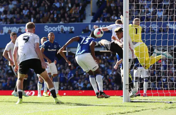 LIVERPOOL, ENGLAND - SEPTEMBER 21:  Yerry Mina of Everton (13) scores an own goal for Sheffield United's first goal during the Premier League match between Everton FC and Sheffield United at Goodison Park on September 21, 2019 in Liverpool, United Kingdom. (Photo by Christopher Lee/Getty Images)