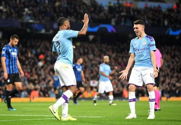 MANCHESTER, ENGLAND - OCTOBER 22: Raheem Sterling of Manchester City celebrates after scoring his team's fourth goal with teammate Phil Foden during the UEFA Champions League group C match between Manchester City and Atalanta at Etihad Stadium on October 22, 2019 in Manchester, United Kingdom. (Photo by Michael Regan/Getty Images)