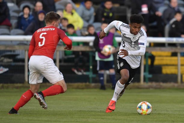DUBLIN, IRELAND - MAY 10: Karim Adeyemi of Germany and Julian Selmeister of Austria during the UEFA Under 17 European Championship Group D football match between Austria and Germany at Carlisle Grounds stadium on May 10, 2019 in Dublin, Ireland. (Photo by Charles McQuillan/Getty Images)