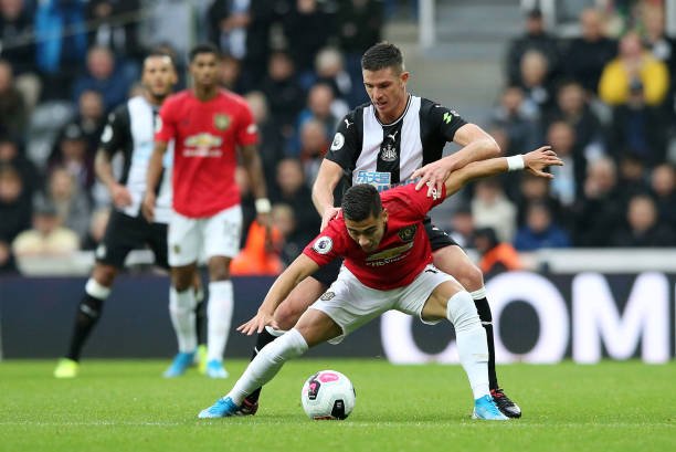 Andreas Pereira of Manchester United holds off Ciaran Clark of Newcastle United  during the Premier League match between Newcastle United and Manchester United at St. James Park on October 06, 2019 in Newcastle upon Tyne, United Kingdom. (Photo by Jan Kruger/Getty Images)