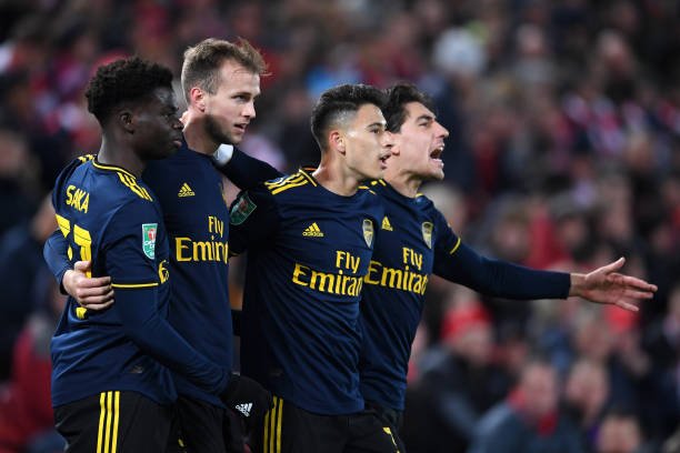 Arsenal's Martinelli issues positive update on his injury recovery (Martinelli is celebrating with his teammates in the photo)