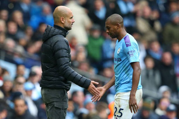 MANCHESTER, ENGLAND - OCTOBER 26: Pep Guardiola, Manager of Manchester City greets Fernandinho of Manchester City as he leaves the pitch after receiving a red card during the Premier League match between Manchester City and Aston Villa at Etihad Stadium on October 26, 2019 in Manchester, United Kingdom. (Photo by Alex Livesey/Getty Images)