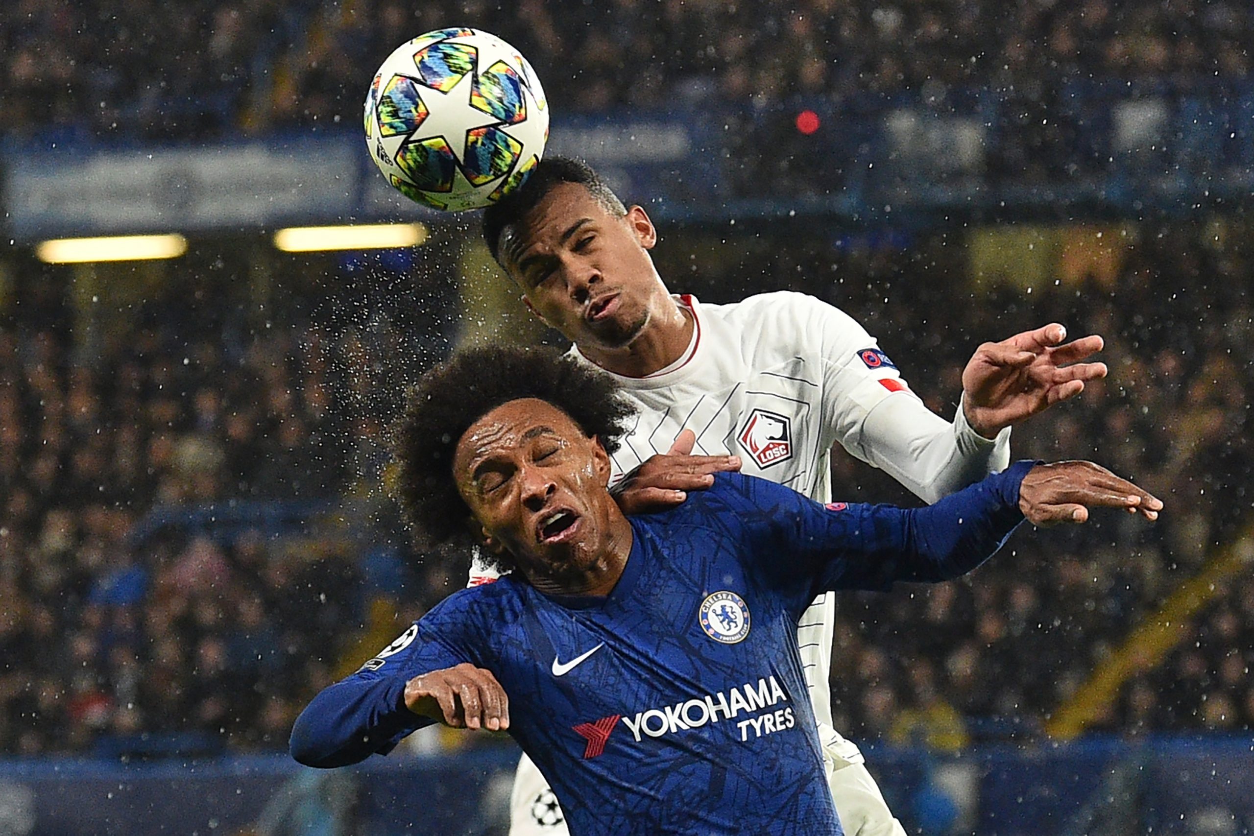 Chelsea's Brazilian midfielder Willian (L) vies with Lille's Brazilian defender Gabriel dos Santos Magalhaes during the UEFA Champion's League Group H football match between Chelsea and Lille at Stamford Bridge in London on December 10, 2019. (Photo by GLYN KIRK/AFP via Getty Images)