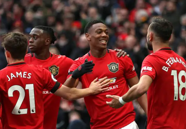 Anthony Martial of Manchester United celebrates with teammates after scoring his team's second goal during the Premier League match between Manchester United and Watford FC at Old Trafford on February 23, 2020 in Manchester, United Kingdom. (Photo by Clive Brunskill/Getty Images)