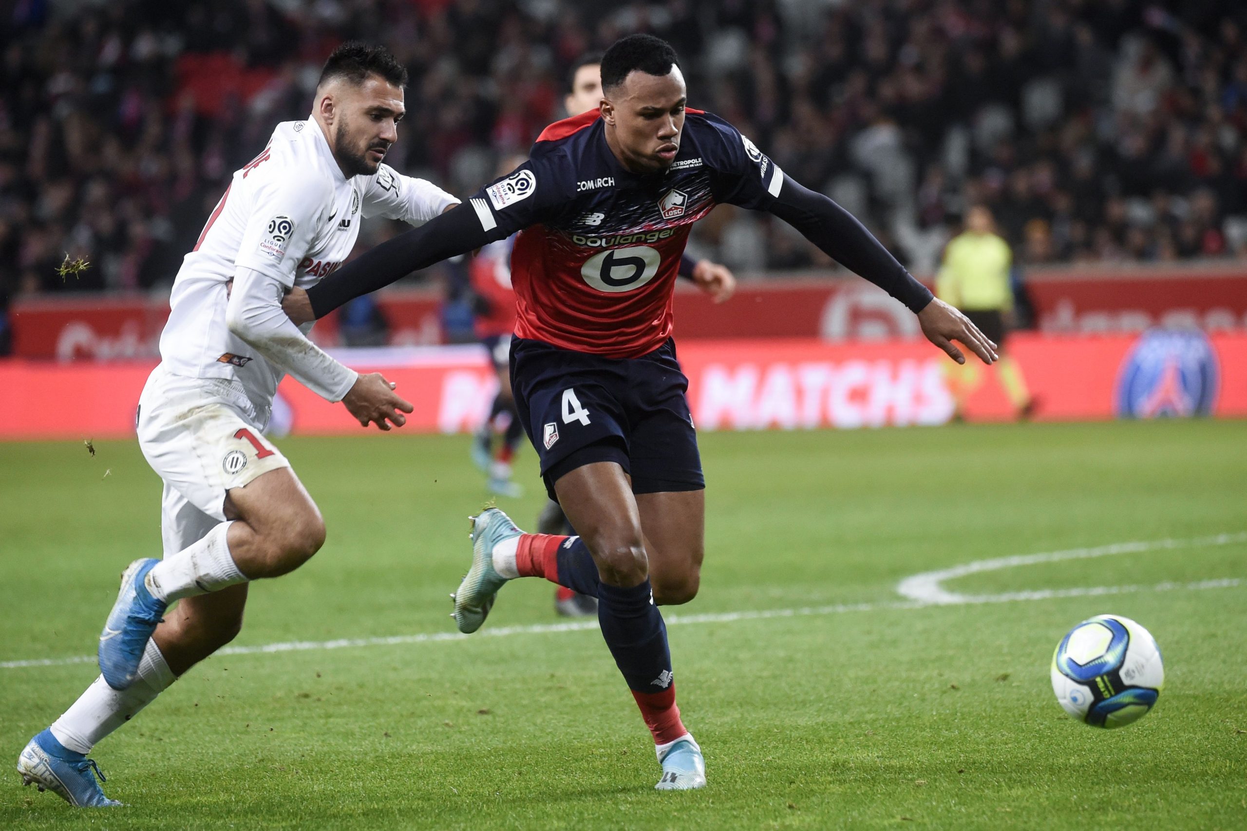Lille's Brazilian defender Gabriel dos Santos Magalhaes (R) fights for the ball with Montpellier's French forward Gaetan Laborde during the French L1 football match between Lille OSC (LOSC) and Montpellier  Herault Sport Club (MHSC) at the Pierre Mauroy Stadium in Villeneuve-d'Ascq, on December 13, 2019. (Photo by FRANCOIS LO PRESTI/AFP via Getty Images)