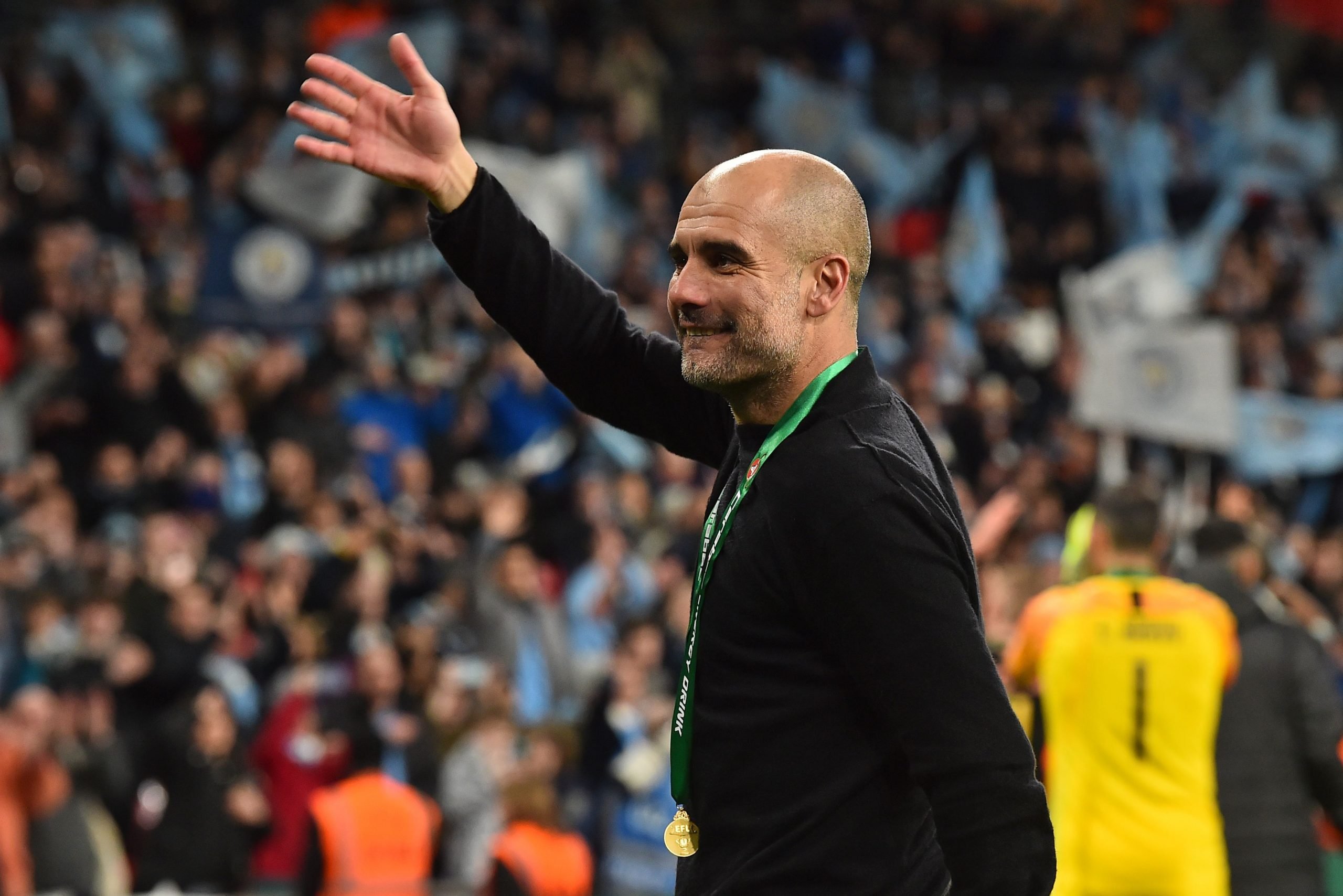 Manchester City's Spanish manager Pep Guardiola celebrates on the pitch after the English League Cup final football match between Aston Villa and Manchester City at Wembley stadium in London on March 1, 2020. - Manchester City won the game 2-1. (Photo by GLYN KIRK/AFP via Getty Images)