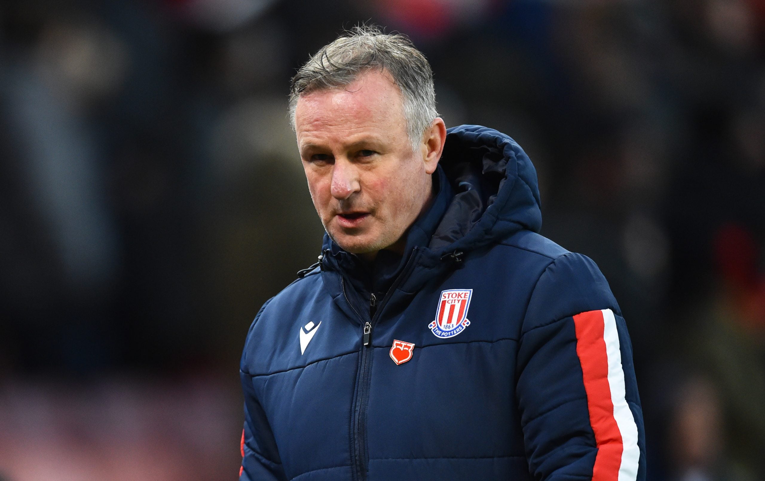 STOKE ON TRENT, ENGLAND - DECEMBER 14: Michael O'Neill manager of Stoke City walks to the changing rooms at half time during the Sky Bet Championship match between Stoke City and Reading at Bet365 Stadium on December 14, 2019 in Stoke on Trent, England. (Photo by Nathan Stirk/Getty Images)