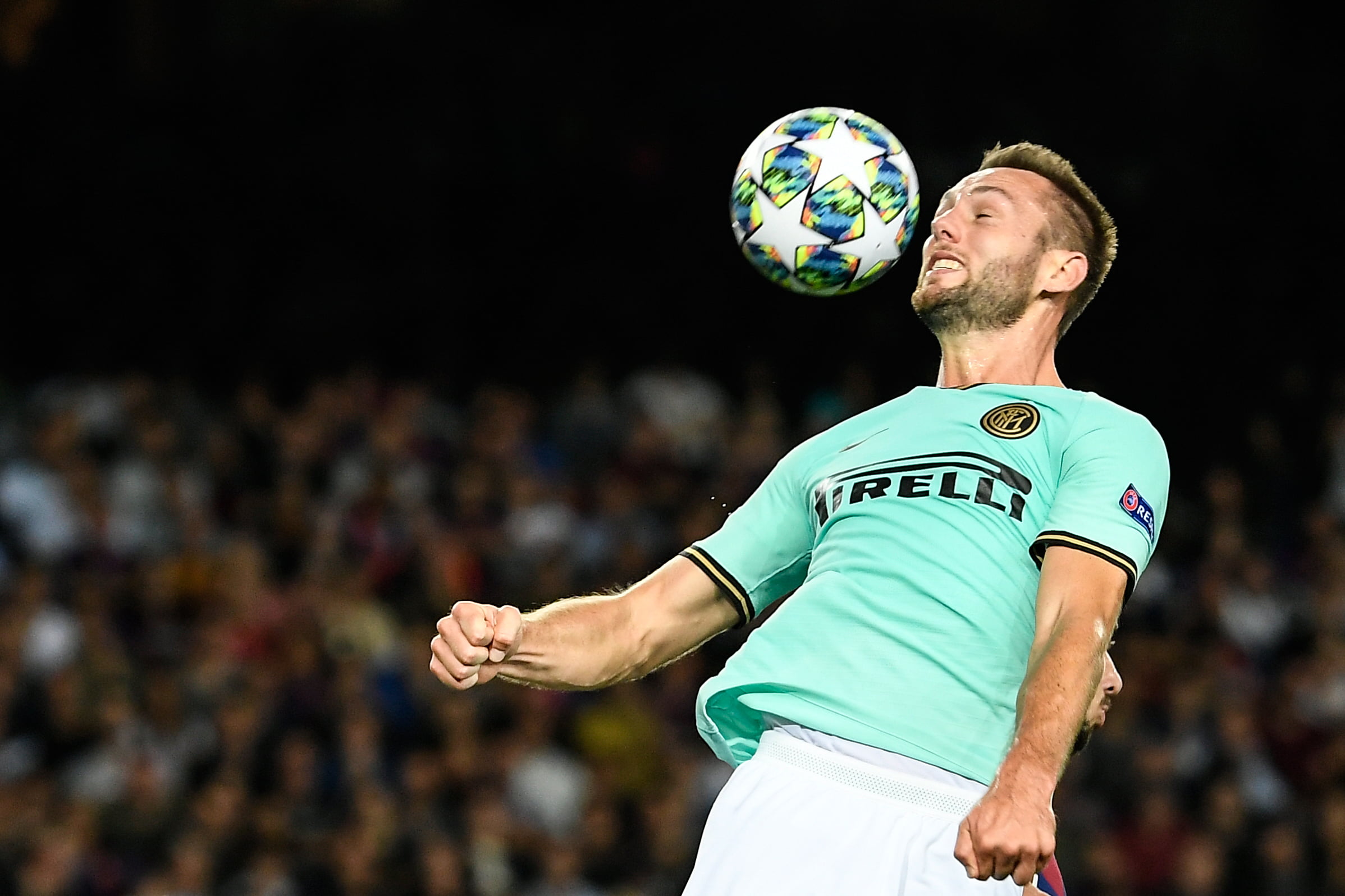 Inter Milan's Slovak defender Milan Skriniar heads the ball during the UEFA Champions League Group F football match between Barcelona and Inter Milan at the Camp Nou stadium in Barcelona, on October 2, 2019. (Photo by LLUIS GENE/AFP via Getty Images)