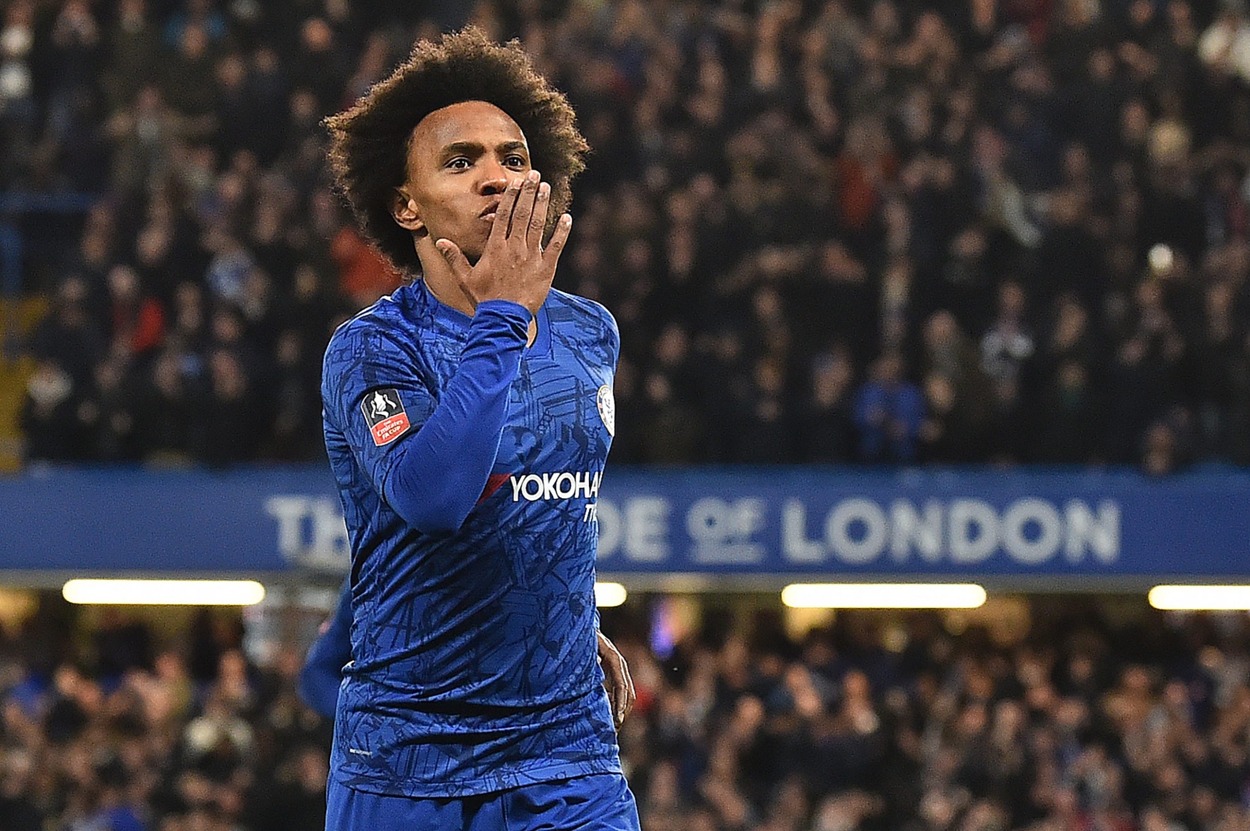 Chelsea's Brazilian midfielder Willian celebrates scoring the opening goal during the English FA Cup fifth round football match between Chelsea and Liverpool at Stamford Bridge in London on March 3, 2020. (Photo by Glyn KIRK / AFP) / RESTRICTED TO EDITORIAL USE. No use with unauthorized audio, video, data, fixture lists, club/league logos or 'live' services. Online in-match use limited to 120 images. An additional 40 images may be used in extra time. No video emulation. Social media in-match use limited to 120 images. An additional 40 images may be used in extra time. No use in betting publications, games or single club/league/player publications. /  (Photo by GLYN KIRK/AFP via Getty Images)