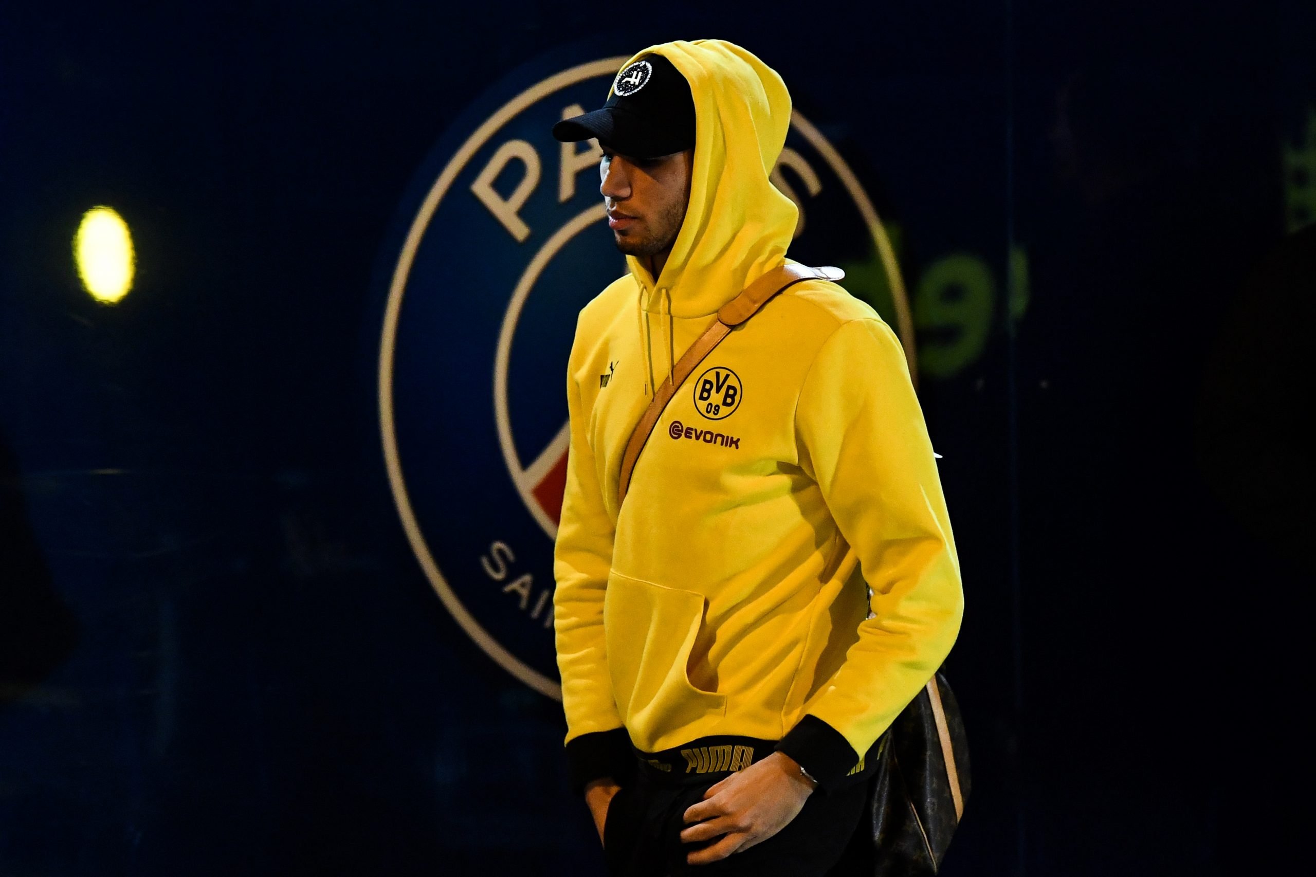 Dortmund's Moroccan defender Achraf Hakimi arrives to attend the UEFA Champions League round of 16 second leg football match between Paris Saint-Germain (PSG) and Borussia Dortmund, outside the Parc des Princes stadium, in Paris, on March 11, 2020. - The match between Paris Saint-Germain (PSG) and Borussia Dortmund, is held behind closed doors due to the spread of COVID-19, the novel coronavirus. (Photo by FRANCK FIFE/AFP via Getty Images)