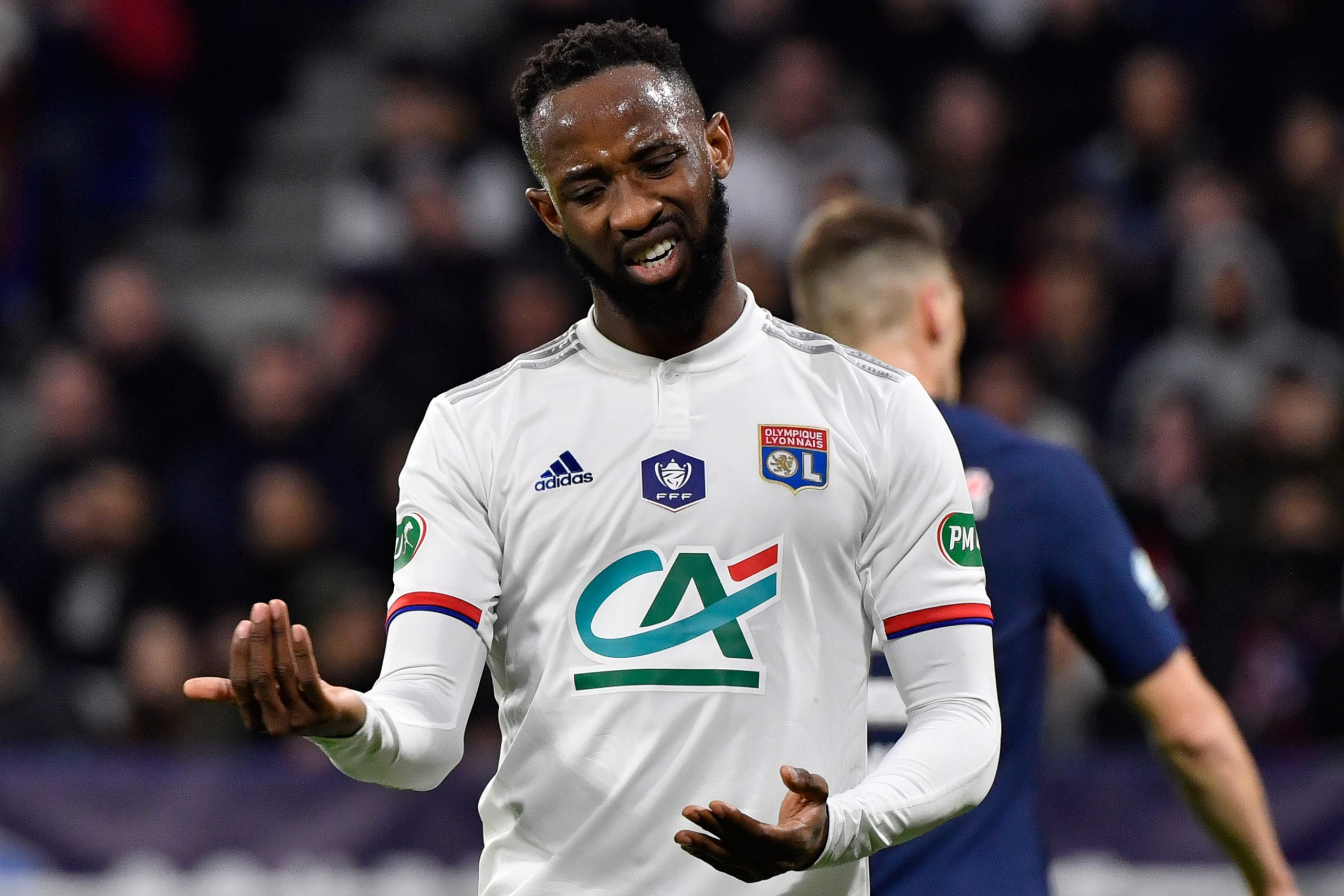 Lyon's French forward Moussa Dembele reacts during the French Cup semi-final football match between Olympique Lyonnais (OL) and Paris Saint-Germain (PSG) at the Groupama Stadium in Decines-Charpieu, centraleastern France, on March 4, 2020. (Photo by Philippe DESMAZES / AFP) (Photo by PHILIPPE DESMAZES/AFP via Getty Images)