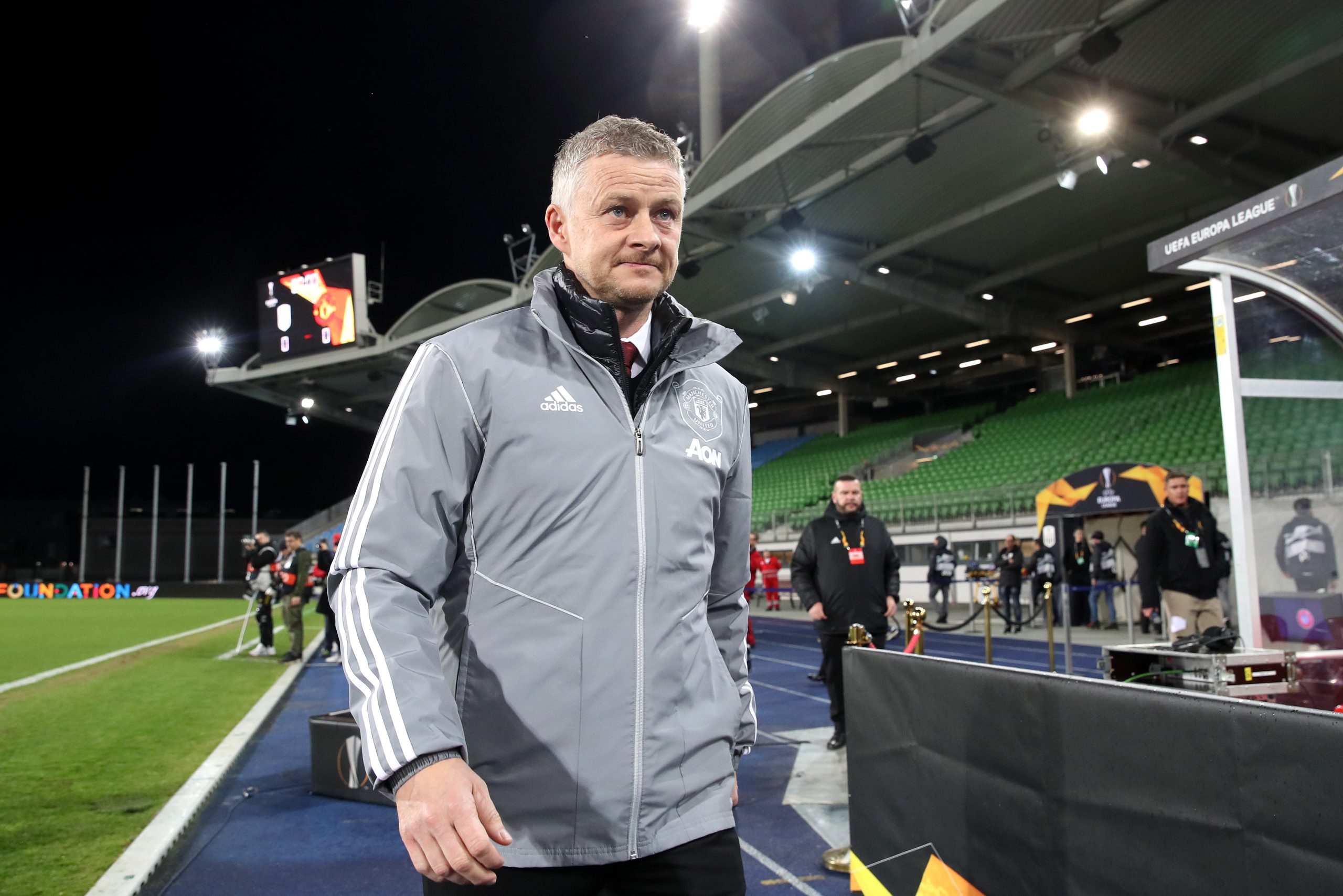 LINZ, AUSTRIA - MARCH 12: (FREE FOR EDITORIAL USE) In this handout image provided by UEFA, Ole Gunnar Solskjaer, Manager of Manchester United walks to his seat prior to the UEFA Europa League round of 16 first leg match between LASK and Manchester United at Linzer Stadion on March 12, 2020 in Linz, Austria. The match is played behind closed doors as a precaution against the spread of COVID-19 (Coronavirus).  (Photo by UEFA - Handout/UEFA via Getty Images )