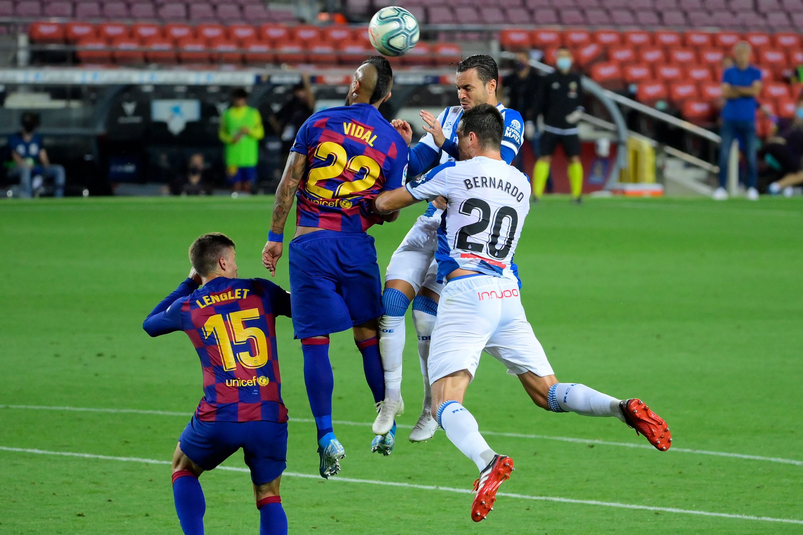 Barcelona's Vidal in talks to terminate his contract this summer (Vidal is attempting to head the ball in the photo)