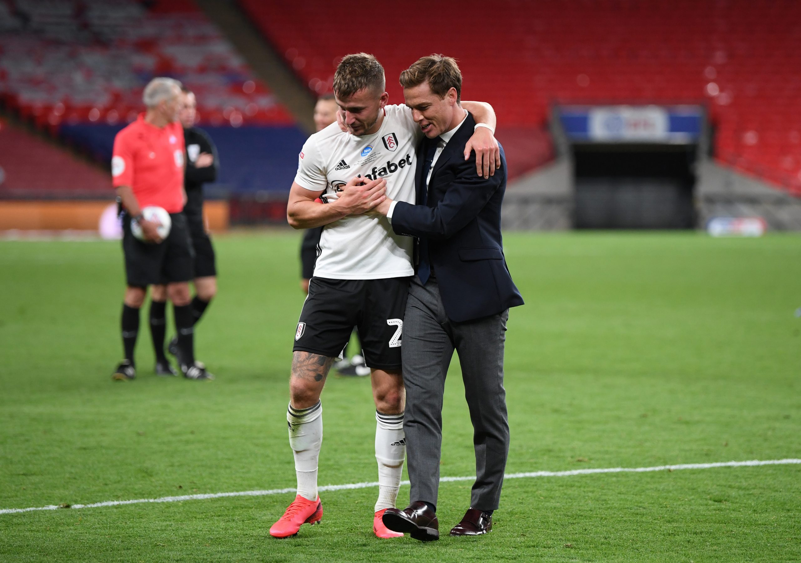 LONDON, ENGLAND - AUGUST 04: Scott Parker manager of Fulham celebrates with goalscorer Joe Bryan of Fulham after the Sky Bet Championship Play Off Final match between Brentford and Fulham at Wembley Stadium on August 04, 2020 in London, England. Football Stadiums around Europe remain empty due to the Coronavirus Pandemic as Government social distancing laws prohibit fans inside venues resulting in all fixtures being played behind closed doors. (Photo by Shaun Botterill/Getty Images)