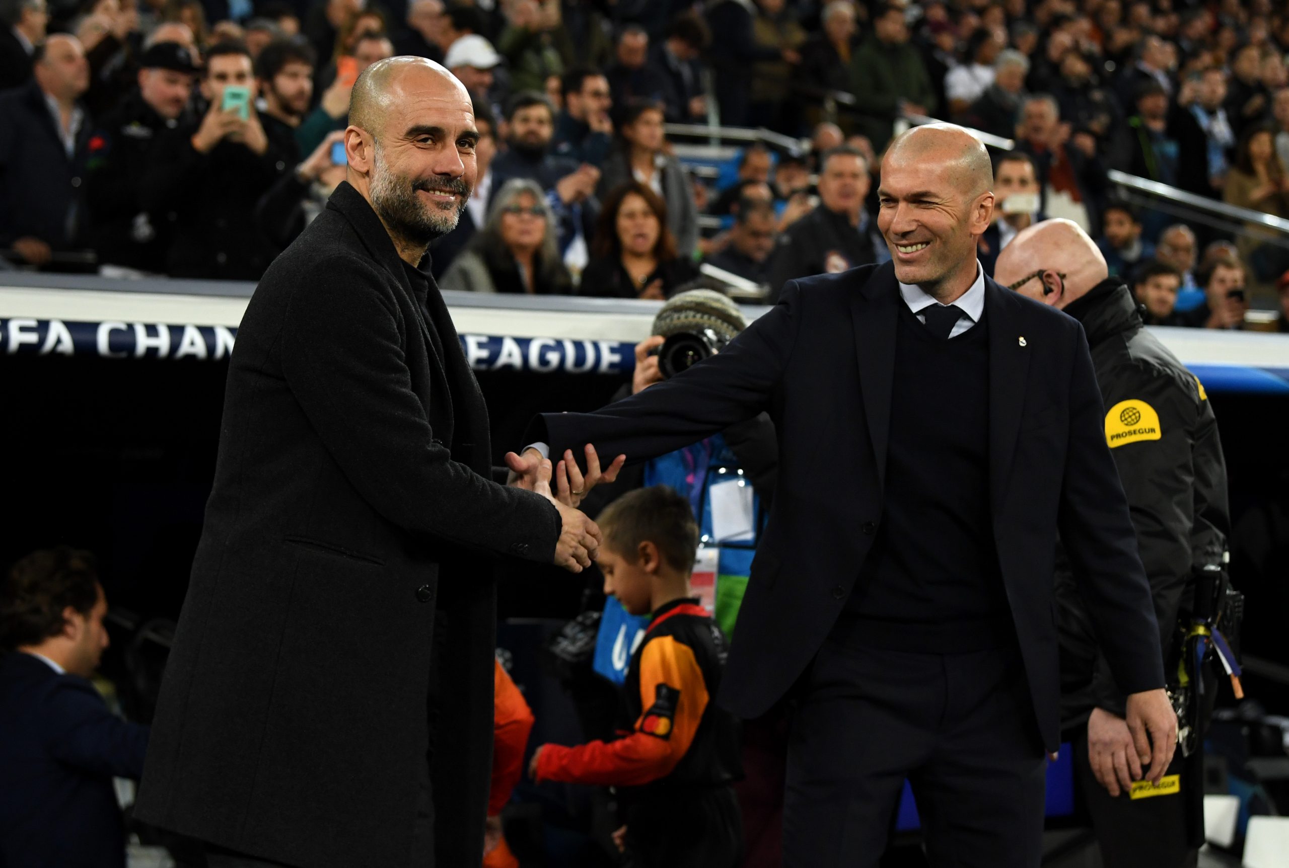 MADRID, SPAIN - FEBRUARY 26: Pep Guardiola, Manager of Manchester City shakes hands with Zinedine Zidane, Manager of Real Madrid prior to the UEFA Champions League round of 16 first leg match between Real Madrid and Manchester City at Bernabeu on February 26, 2020 in Madrid, Spain. (Photo by David Ramos/Getty Images)