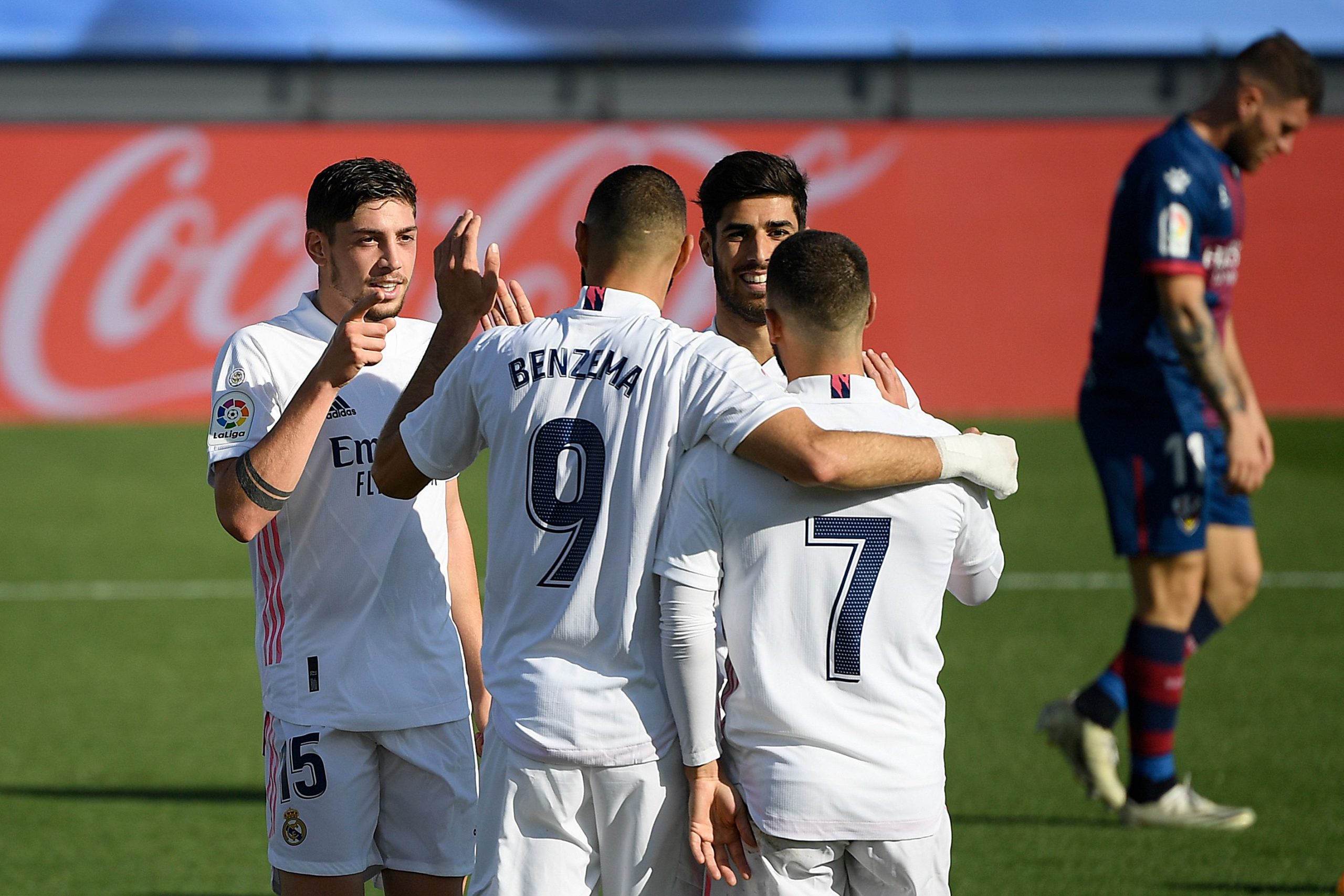 Real Madrid's Uruguayan midfielder Federico Valverde (L) celebrates with teammates after scoring his team's third goal during the Spanish League football match between Real Madrid and SD Huesca at the Alfredo Di Stefano stadium in Valdebebas, northeastern Madrid, on October 31, 2020. (Photo by OSCAR DEL POZO / AFP) (Photo by OSCAR DEL POZO/AFP via Getty Images)