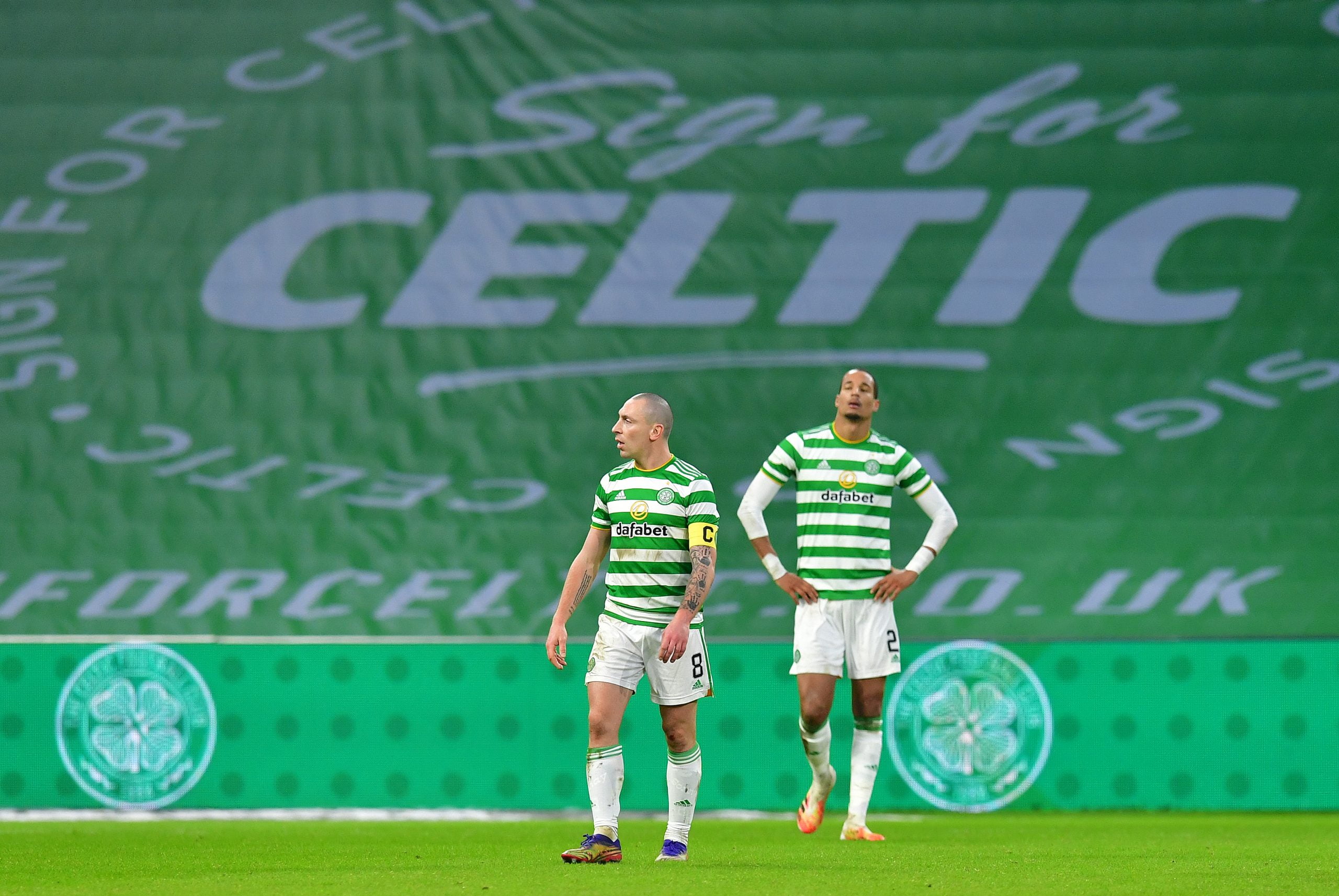 GLASGOW, SCOTLAND - NOVEMBER 29: Scott Brown and Christopher Jullien of Celtic look dejected after conceding their sides second goal during the Betfred Cup match between Celtic and Ross County at Celtic Park on November 29, 2020 in Glasgow, Scotland. Sporting stadiums around the UK remain under strict restrictions due to the Coronavirus Pandemic as Government social distancing laws prohibit fans inside venues resulting in games being played behind closed doors. (Photo by Mark Runnacles/Getty Images)