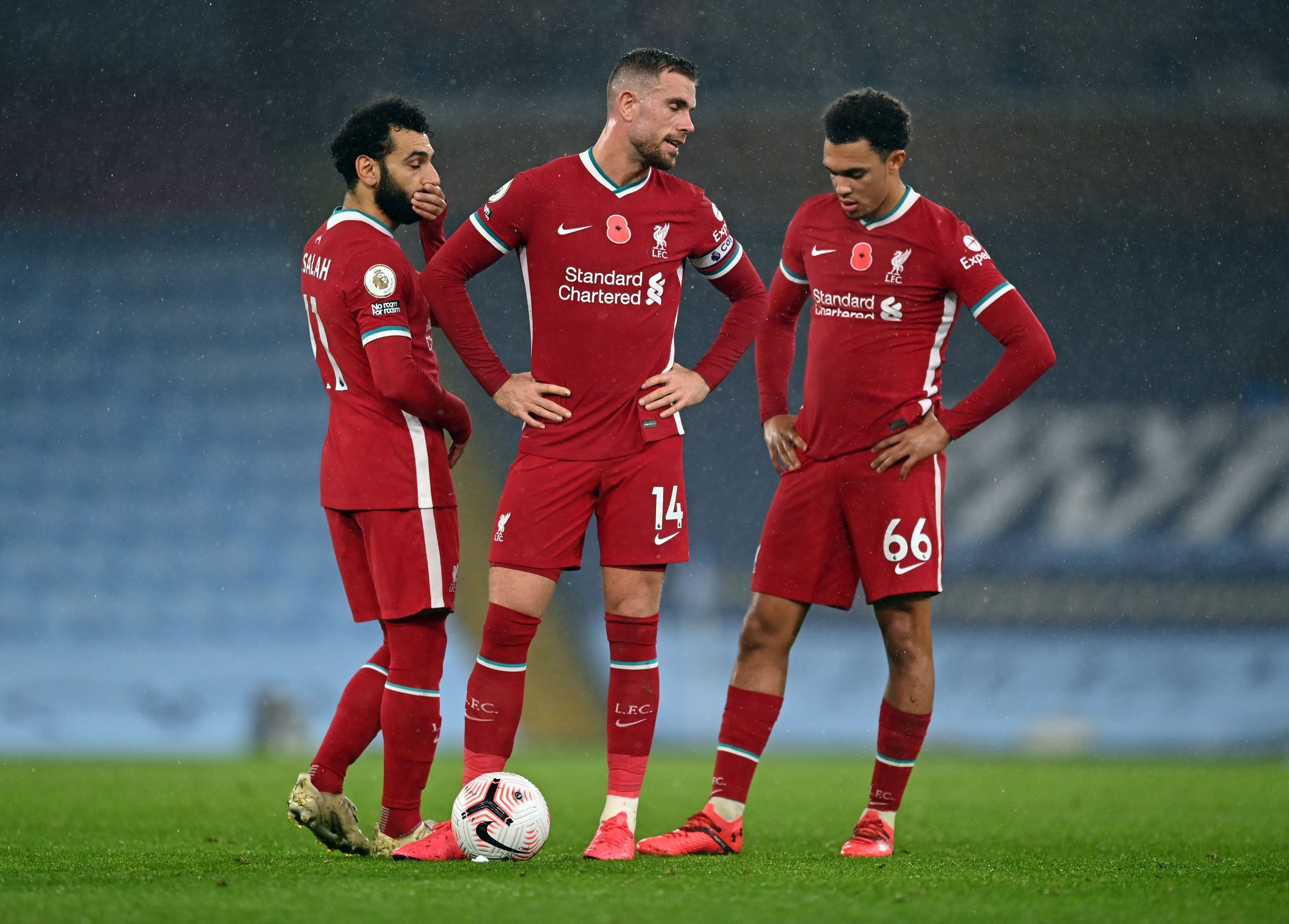 Liverpool's Henderson set to miss several matches due to injury (Henderson is standing in the middle in the photo)