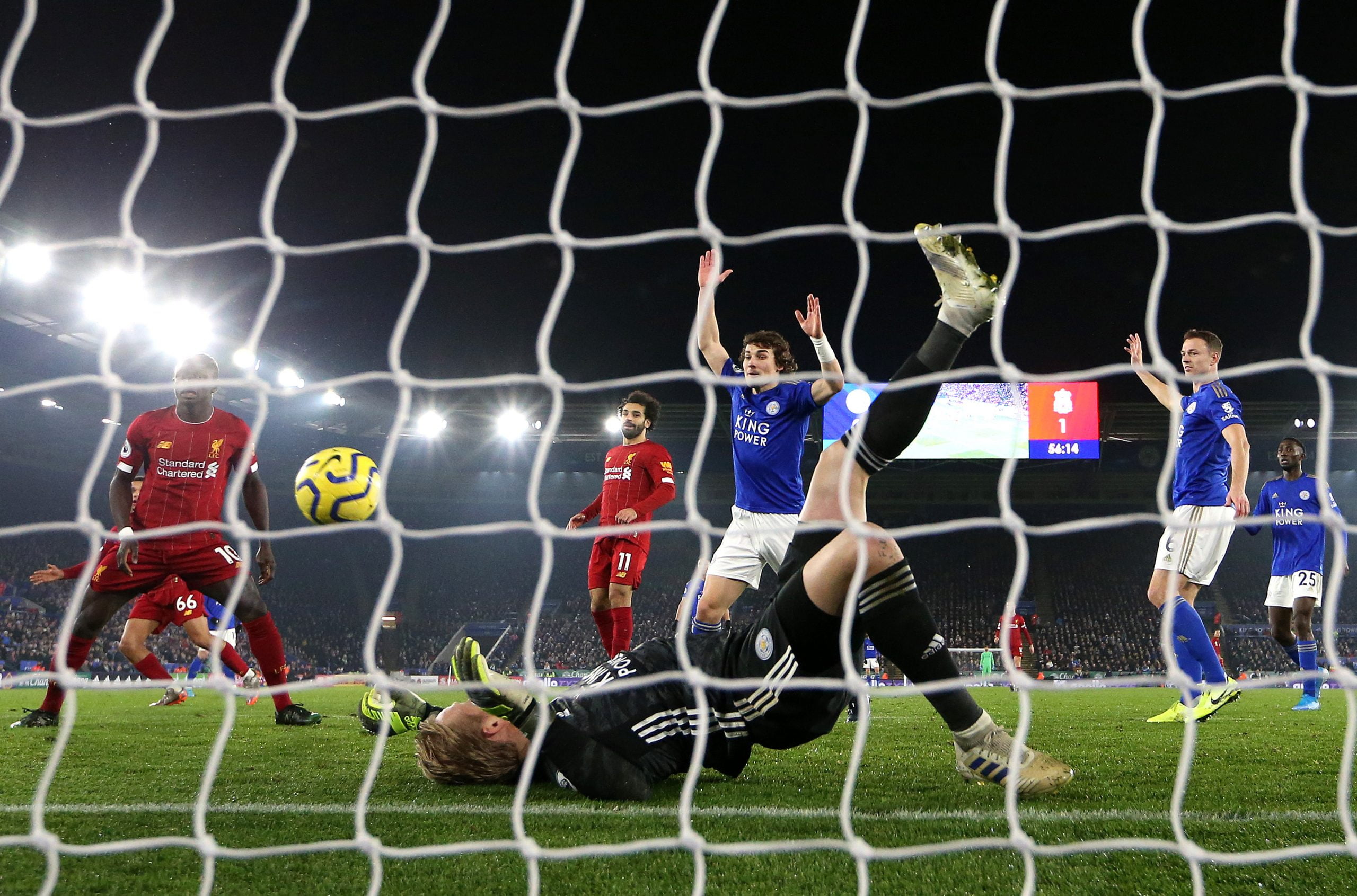 LEICESTER, ENGLAND - DECEMBER 26: Caglar Soyuncu of Leicester City reacts as Kasper Schmeichel of Leicester City makes a save during the Premier League match between Leicester City and Liverpool FC at The King Power Stadium on December 26, 2019 in Leicester, United Kingdom. (Photo by Alex Pantling/Getty Images)
