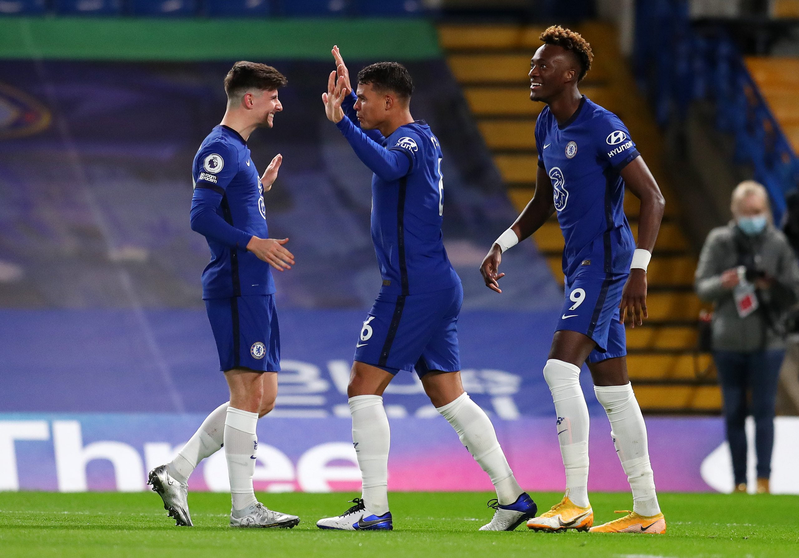 Thiago Silva of Chelsea celebrates with teammates Mason Mount and Tammy Abraham after scoring their team's first goal during the Premier League match between Chelsea and West Ham United at Stamford Bridge on December 21, 2020 in London, England.  (Photo by Catherine Ivill/Getty Images)