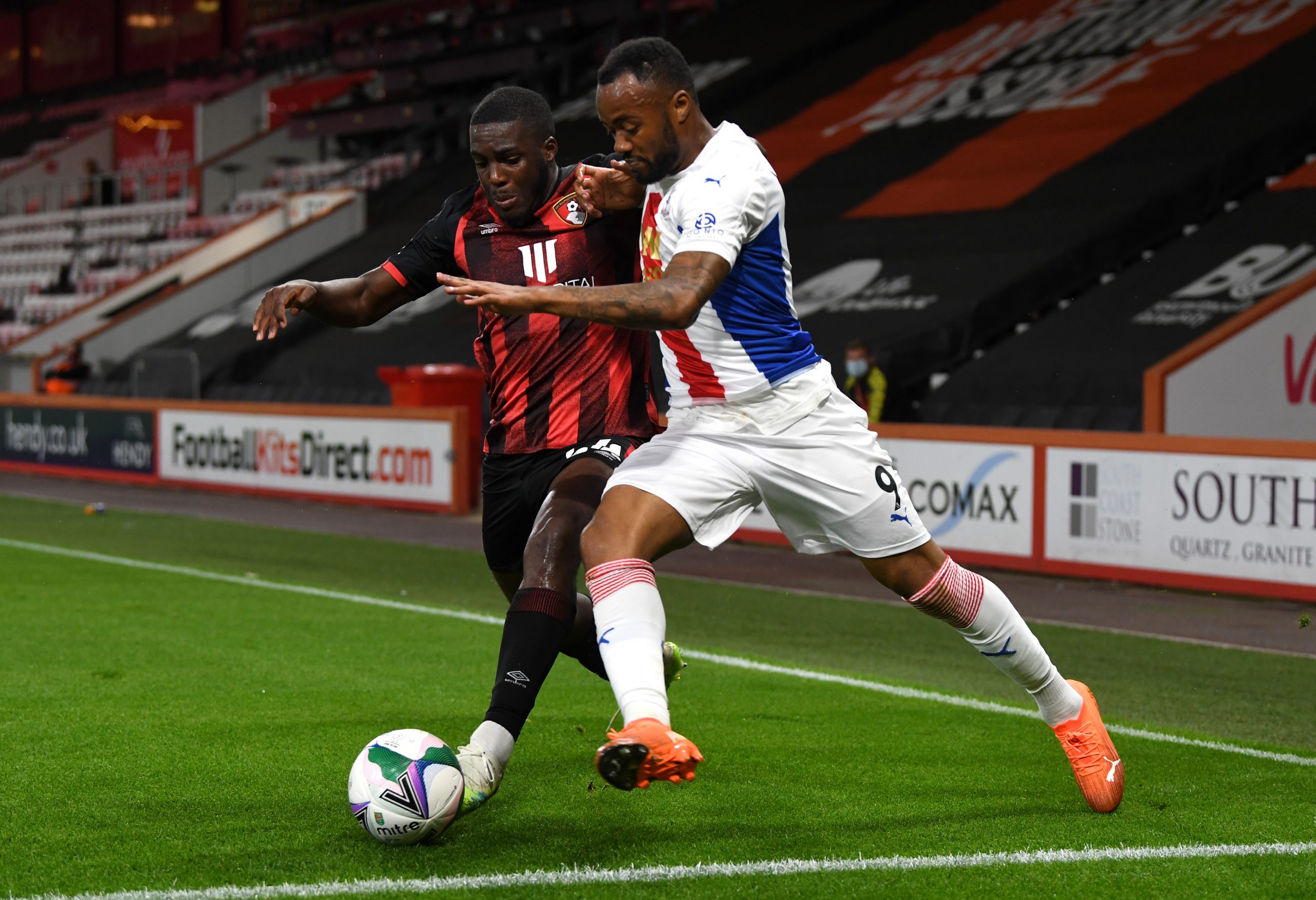 BOURNEMOUTH, ENGLAND - SEPTEMBER 15: Nnamdi Ofoborh of AFC Bournemouth and Jordan Ayew of Crystal Palace battle for the ball  during the Carabao Cup Second Round match between AFC Bournemouth and Crystal Palace at Vitality Stadium on September 15, 2020 in Bournemouth, England. (Photo by Neil Hall - Pool/Getty Images)