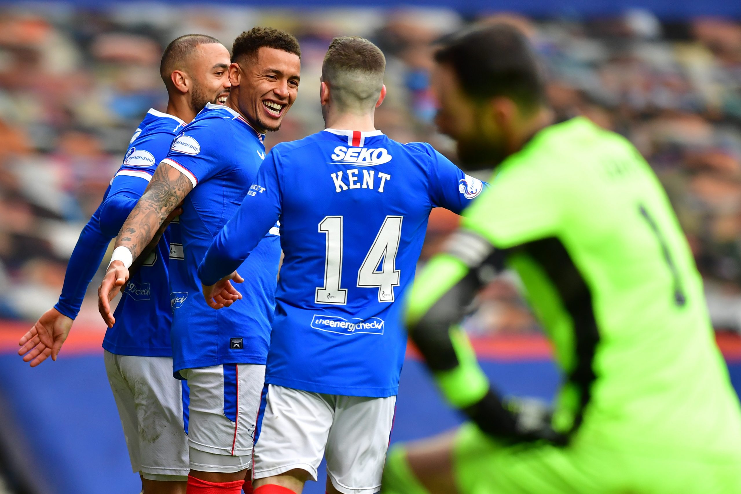 GLASGOW, SCOTLAND - NOVEMBER 22: James Tavernier of Rangers(2L) celebrates after scoring their sides fourth goal from the penalty spot during the Ladbrokes Scottish Premiership match between Rangers and Aberdeen at Ibrox Stadium on November 22, 2020 in Glasgow, Scotland. Sporting stadiums around the UK remain under strict restrictions due to the Coronavirus Pandemic as Government social distancing laws prohibit fans inside venues resulting in games being played behind closed doors. (Photo by Mark Runnacles/Getty Images)