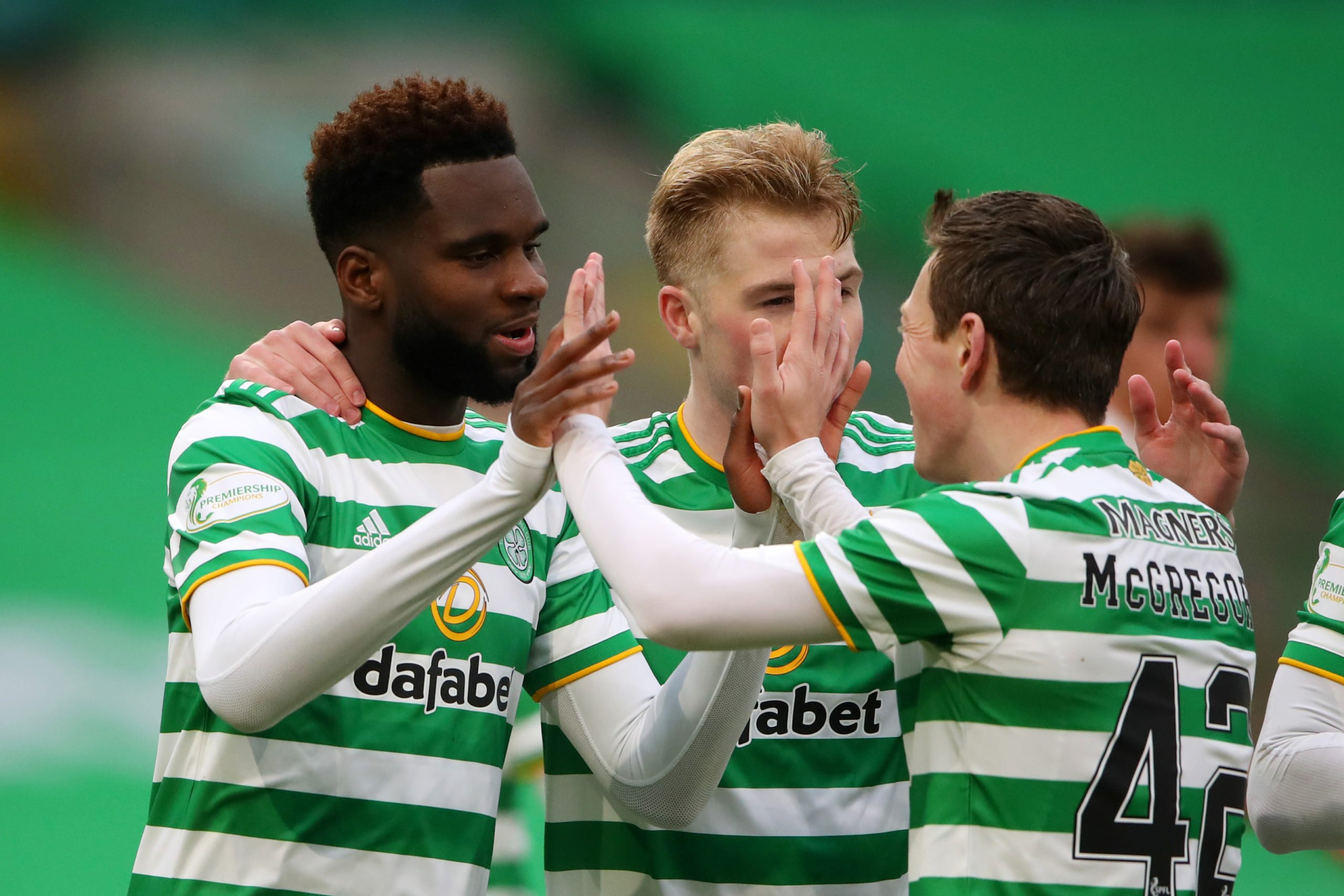 GLASGOW, SCOTLAND - FEBRUARY 06: Odsonne Edouard of Celtic celebrates with teammate Callum McGregor after scoring his team's second goal during the Ladbrokes Scottish Premiership match between Celtic and Motherwell at Celtic Park on February 06, 2021 in Glasgow, Scotland. Sporting stadiums around the UK remain under strict restrictions due to the Coronavirus Pandemic as Government social distancing laws prohibit fans inside venues resulting in games being played behind closed doors. (Photo by Ian MacNicol/Getty Images)