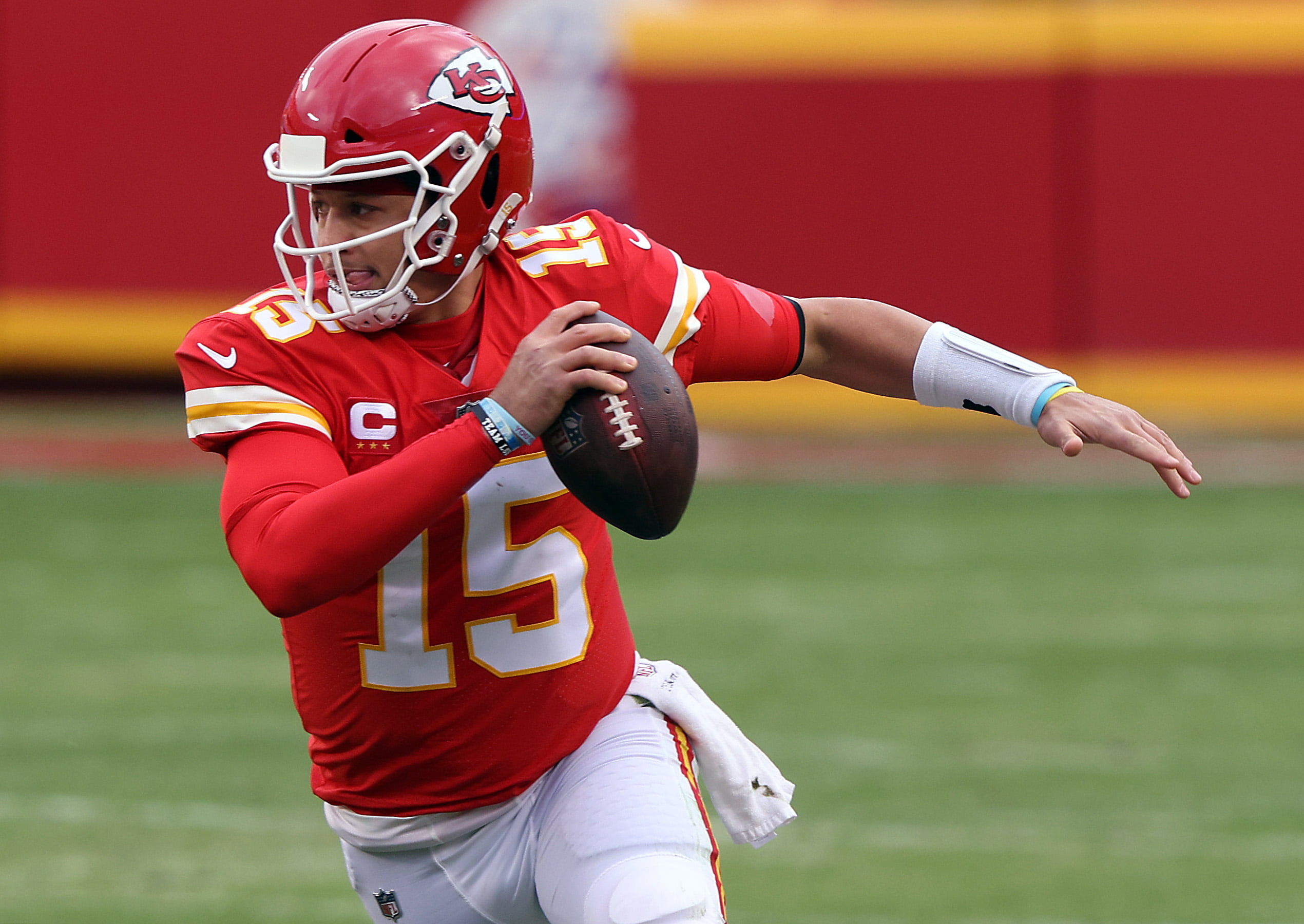 KANSAS CITY, MISSOURI - JANUARY 17:  Quarterback Patrick Mahomes #15 of the Kansas City Chiefs scrambles during the AFC Divisional Playoff game against the Cleveland Browns at Arrowhead Stadium on January 17, 2021 in Kansas City, Missouri. (Photo by Jamie Squire/Getty Images)