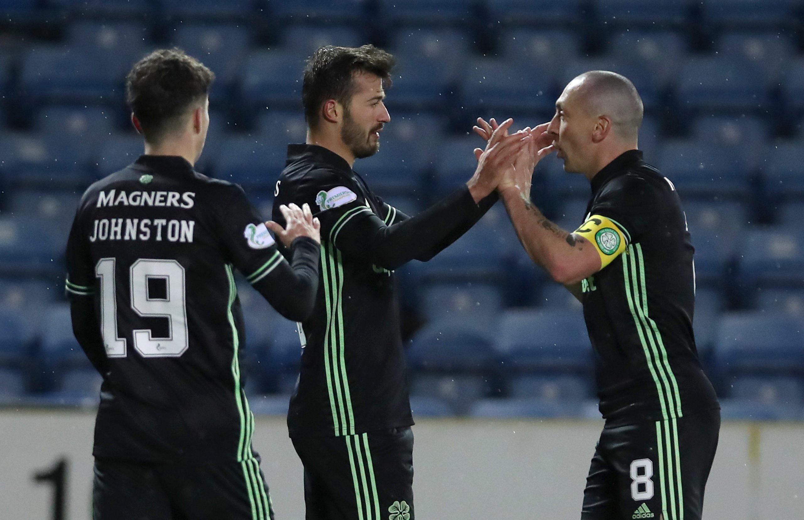 KILMARNOCK, SCOTLAND - FEBRUARY 02: Albian Ajeti of Celtic celebrates with team mate Scott Brown after scoring their side's fourth goal during the Ladbrokes Scottish Premiership match between Kilmarnock and Celtic at Rugby Park on February 02, 2021 in Kilmarnock, Scotland. Sporting stadiums around the UK remain under strict restrictions due to the Coronavirus Pandemic as Government social distancing laws prohibit fans inside venues resulting in games being played behind closed doors. (Photo by Ian MacNicol/Getty Images)
