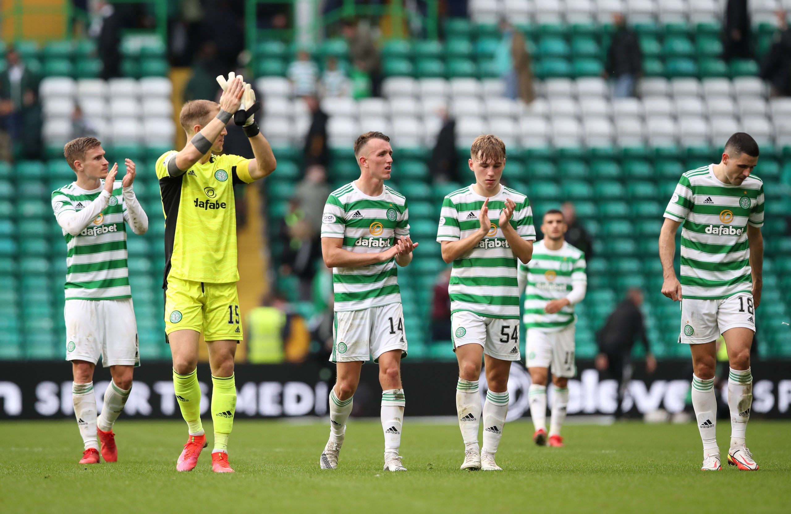 Celtic players applauding the fans
