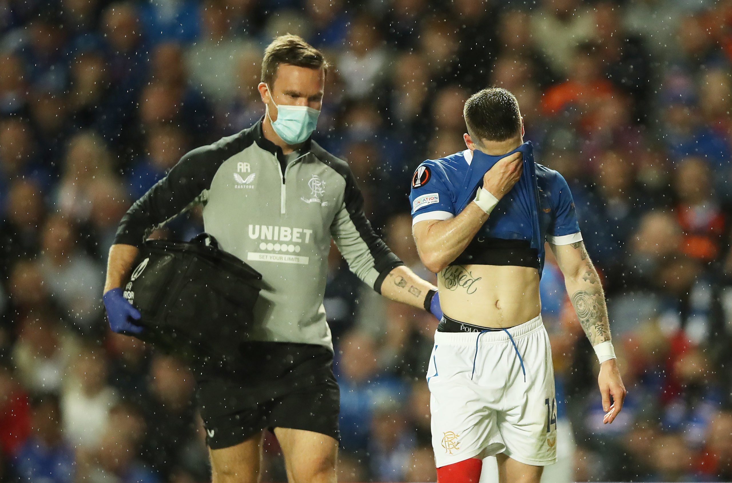 Rangers winger Ryan Kent leaving the pitch with an injury