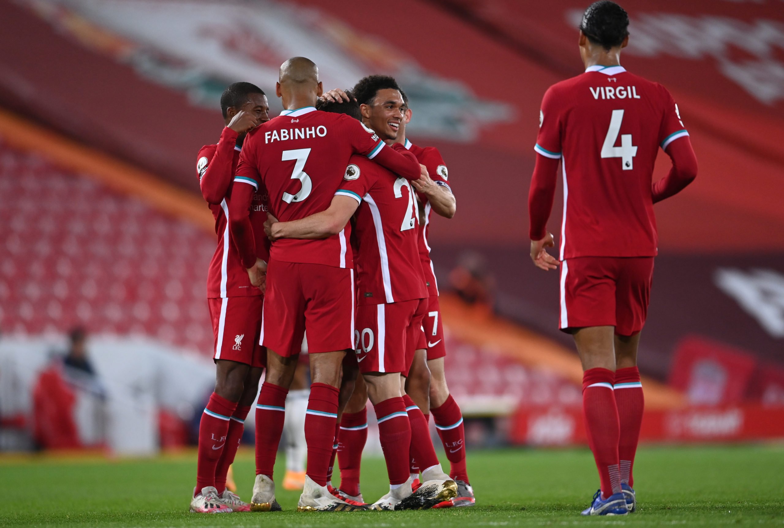 LIVERPOOL, ENGLAND - SEPTEMBER 28: Diogo Jota of Liverpool celebrates with teammates after scoring his sides third goal during the Premier League match between Liverpool and Arsenal at Anfield on September 28, 2020 in Liverpool, England. Sporting stadiums around the UK remain under strict restrictions due to the Coronavirus Pandemic as Government social distancing laws prohibit fans inside venues resulting in games being played behind closed doors. (Photo by Laurence Griffiths/Getty Images)The 4th Official uses images provided by the following image agency: Getty Images (https://www.gettyimages.de/) Imago Images (https://www.imago-images.de/)