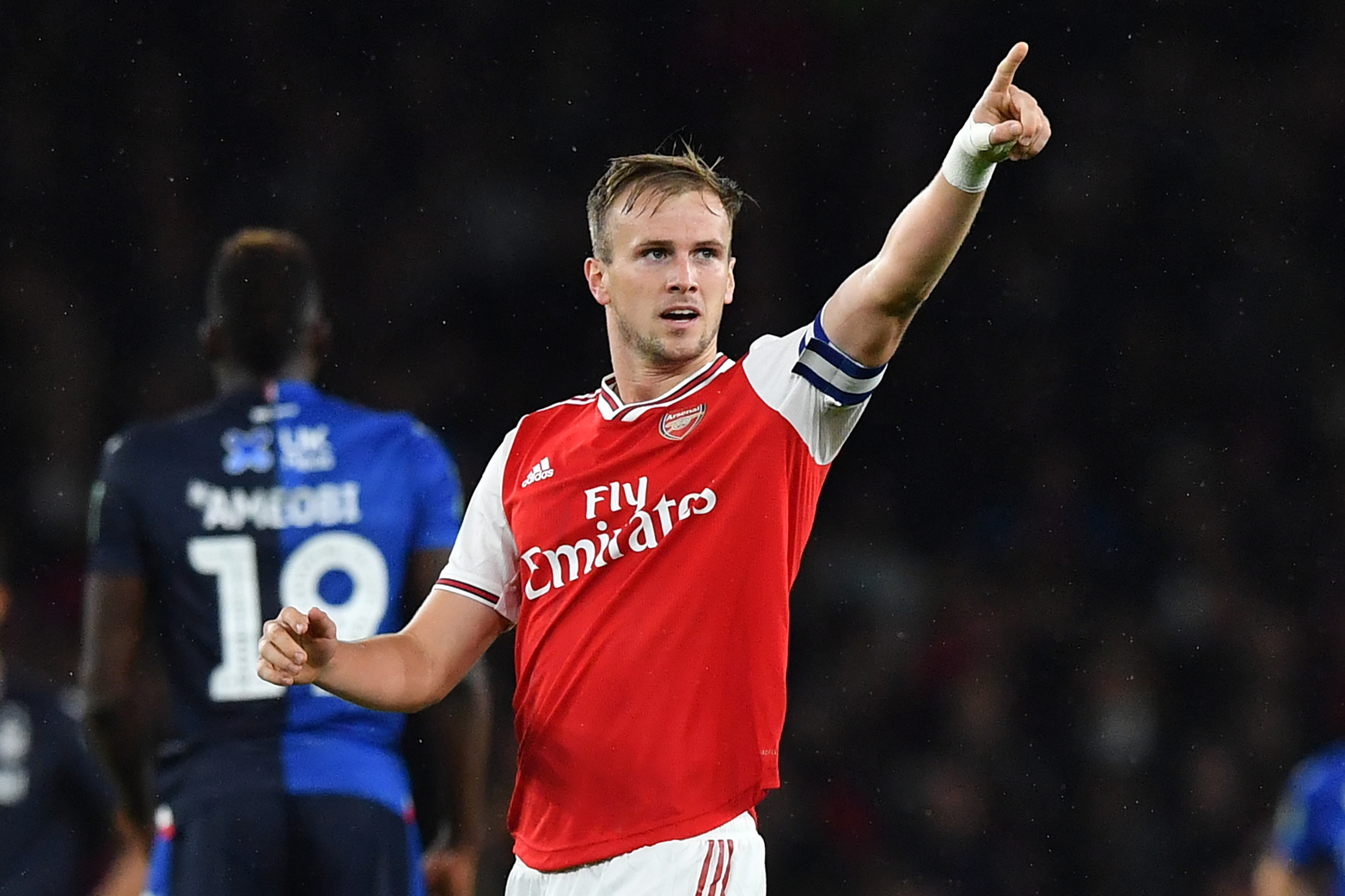 Arsenal's English defender Rob Holding (C) celebrates scoring his team's second goal during the English League Cup third round football match between Arsenal and Nottingham Forest at the Emirates Stadium in London on September 24, 2019. (Photo by Ben STANSALL / AFP) / RESTRICTED TO EDITORIAL USE. No use with unauthorized audio, video, data, fixture lists, club/league logos or 'live' services. Online in-match use limited to 120 images. An additional 40 images may be used in extra time. No video emulation. Social media in-match use limited to 120 images. An additional 40 images may be used in extra time. No use in betting publications, games or single club/league/player publications. /         (Photo credit should read BEN STANSALL/AFP via Getty Images)The 4th Official uses images provided by the following image agency: Getty Images (https://www.gettyimages.de/) and Imago Images (https://www.imago-images.de/).