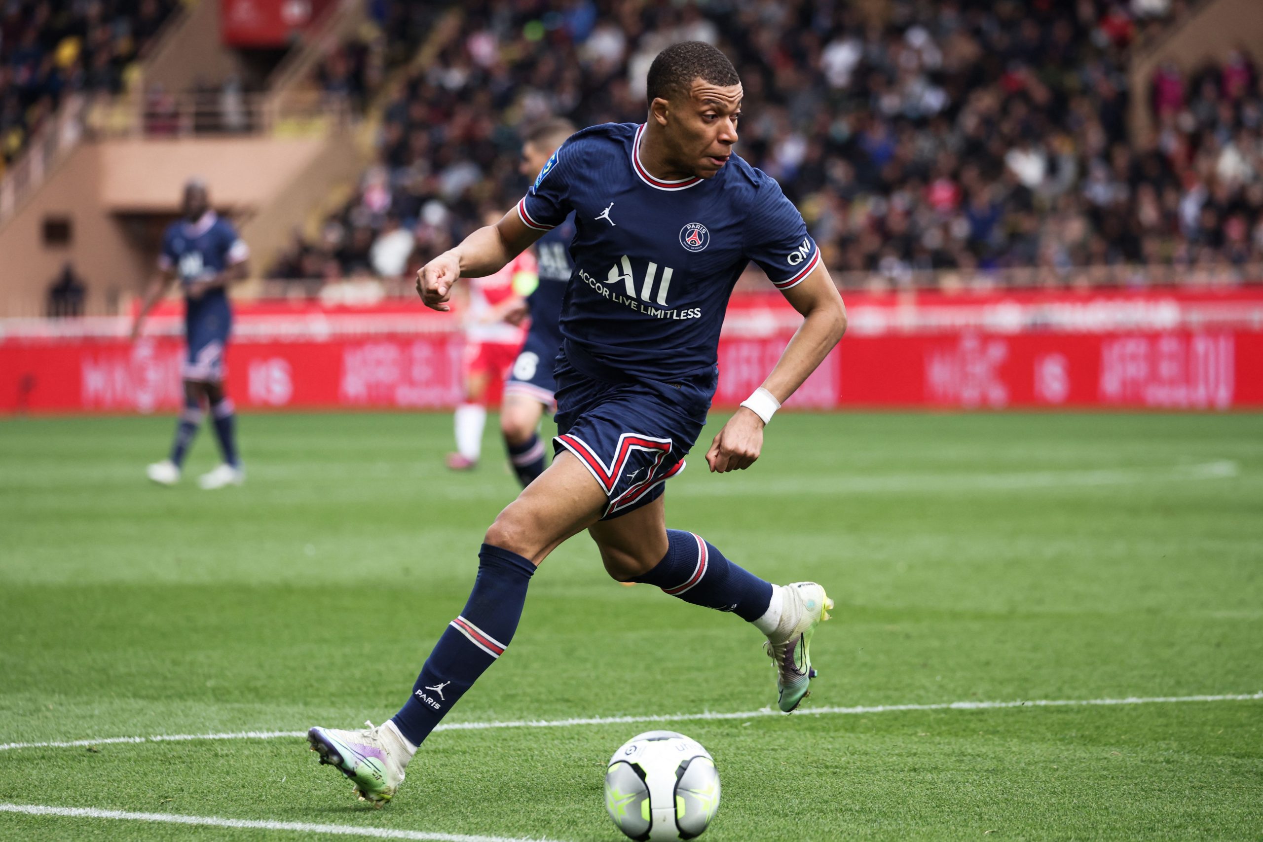 Paris Saint-Germain's French forward Kylian Mbappe runs with the ball during the French L1 football match between AS Monaco and Paris Saint Germain (PSG) at the Louis II Stadium (Stade Louis II) in the Principality of Monaco on March 20, 2022. (Photo by Valery HACHE / AFP) (Photo by VALERY HACHE/AFP via Getty Images) The 4th Official uses images provided by the following image agency: Getty Images (https://www.gettyimages.de/) and Imago Images (https://www.imago-images.de/)