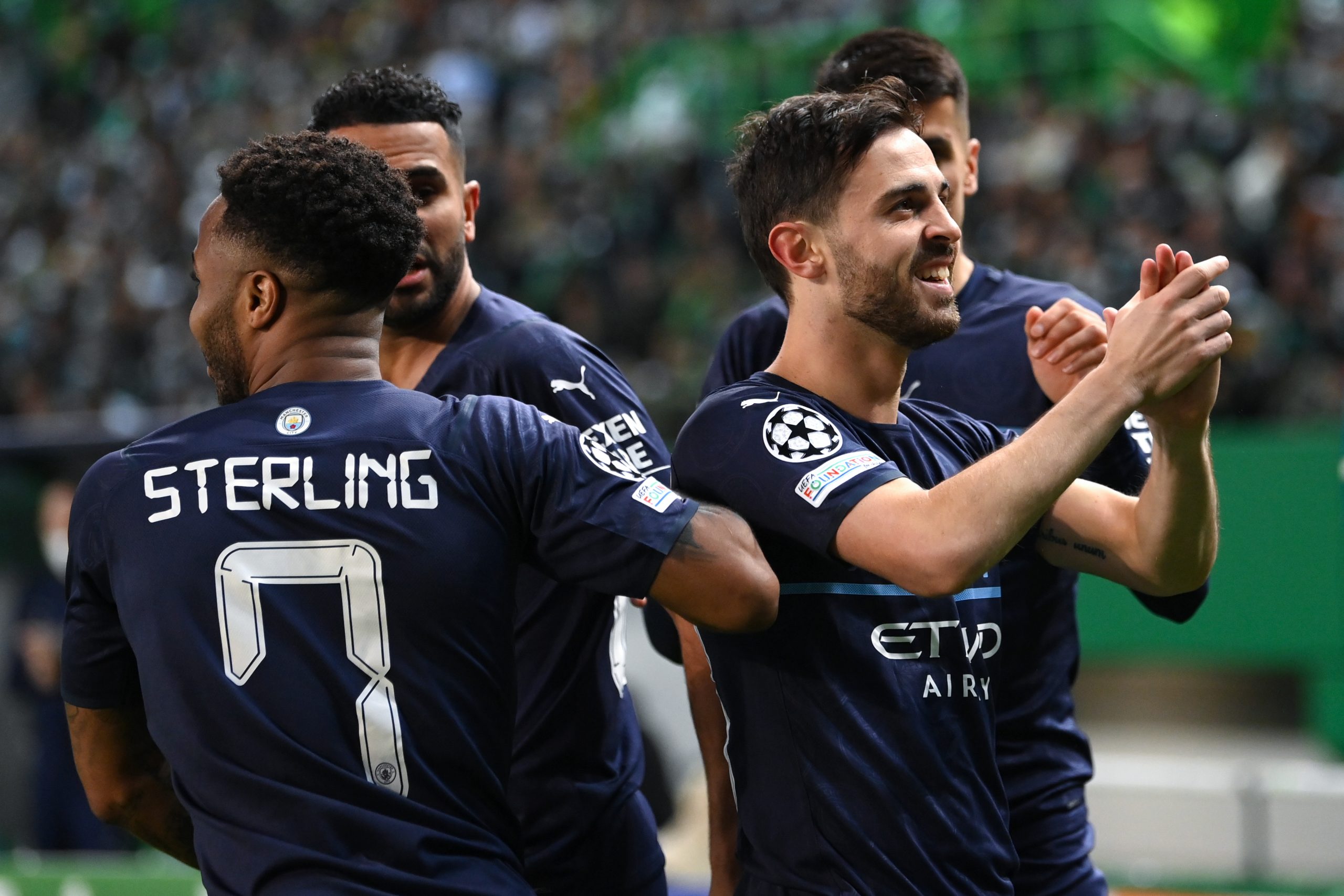 Manchester City players celebrates a goal against Sporting CP