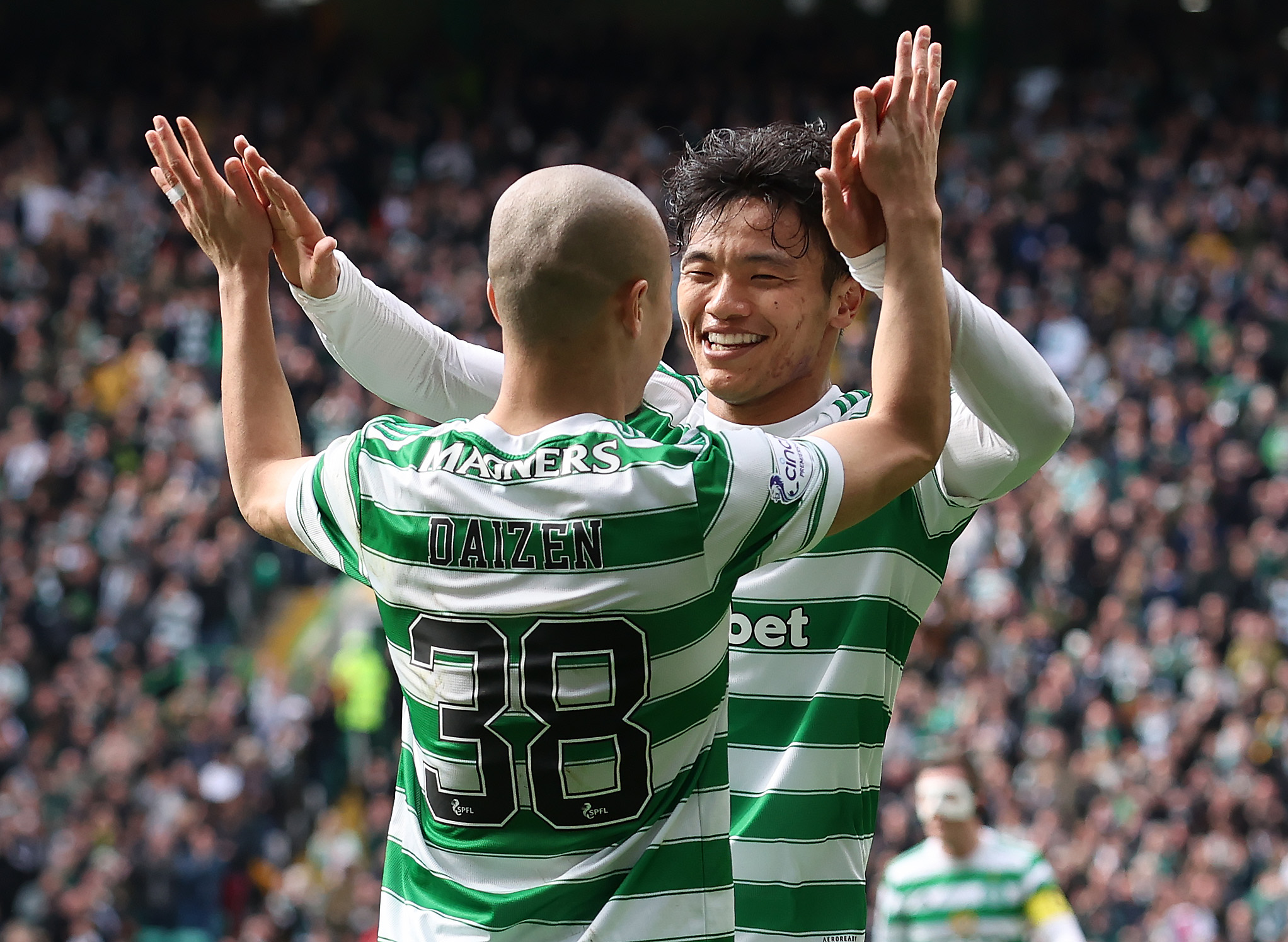 Celtic players celebrate a goal
